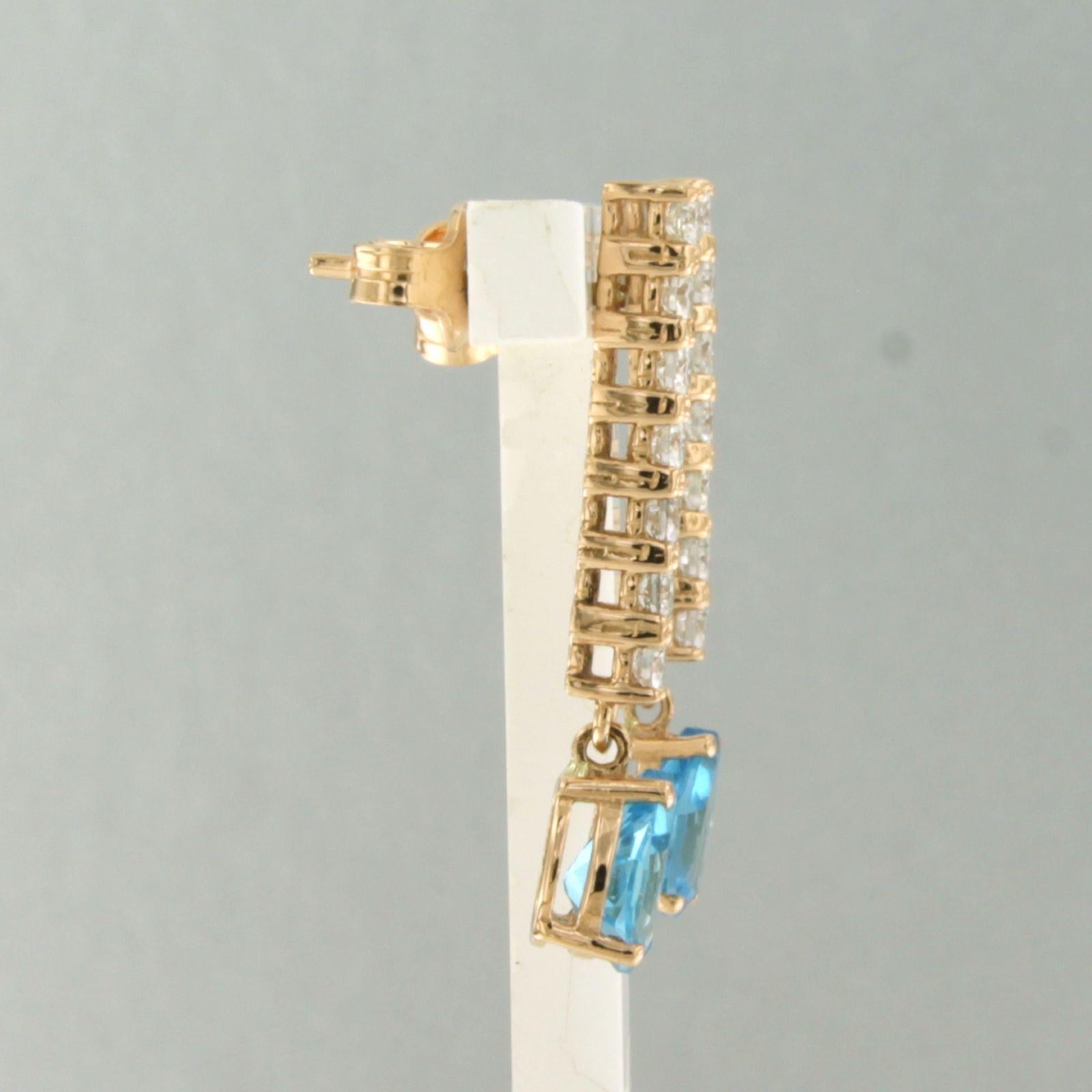 18k rose gold earrings set with topaz and brilliant-cut diamonds up to 0.50 ct – F/G – VS/SI

Detailed description:

The earrings are 2.7 cm long and 5.1 mm wide.

Total weight: 3.3 grams

Set with:

- 2 x 7.0 mm x 5.0 mm teardrop-shaped facet-cut