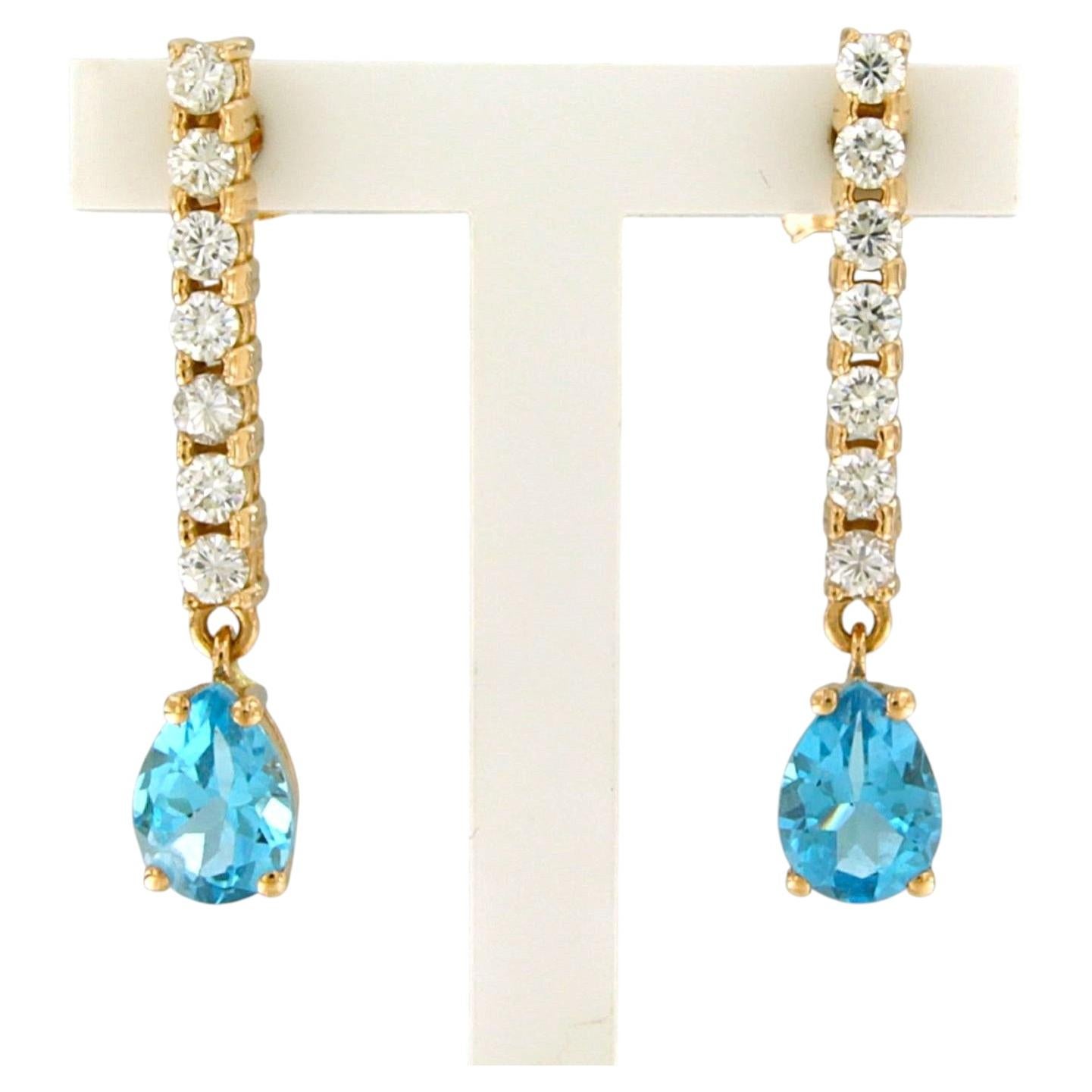 Orecchini con topazio e diamanti taglio brillante fino a 0,50ct in oro 18k 3,3 grammi