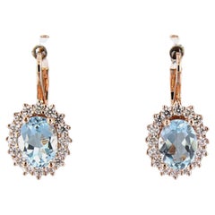 Orecchini con topazio e diamanti taglio brillante fino a 0,60ct 5,5 grammi d'oro 18k