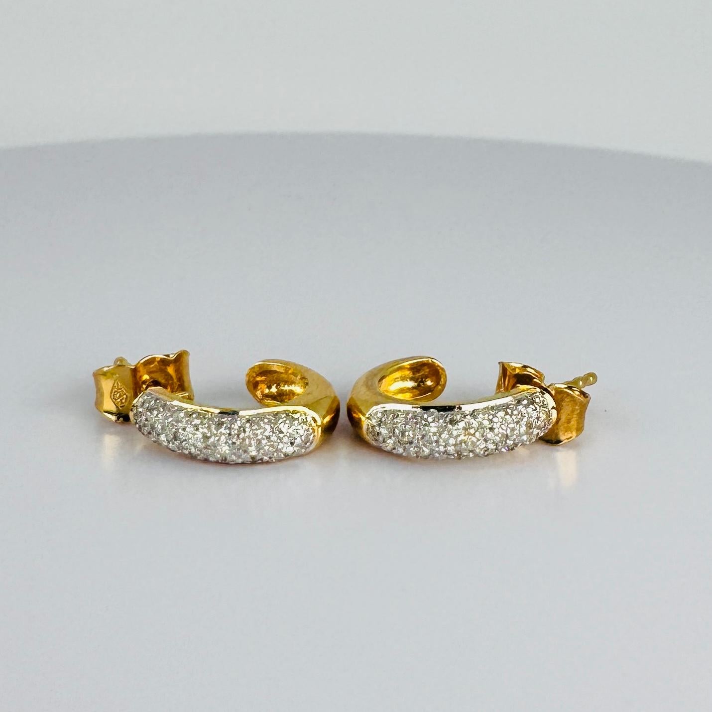 Presenting our vintage 18 carat yellow gold earrings, a perfect blend of elegance and refinement. Each earring is set with diamonds, solidly nestled in these creoles. These preloved earrings are beautifully crafted, showcasing timeless beauty.