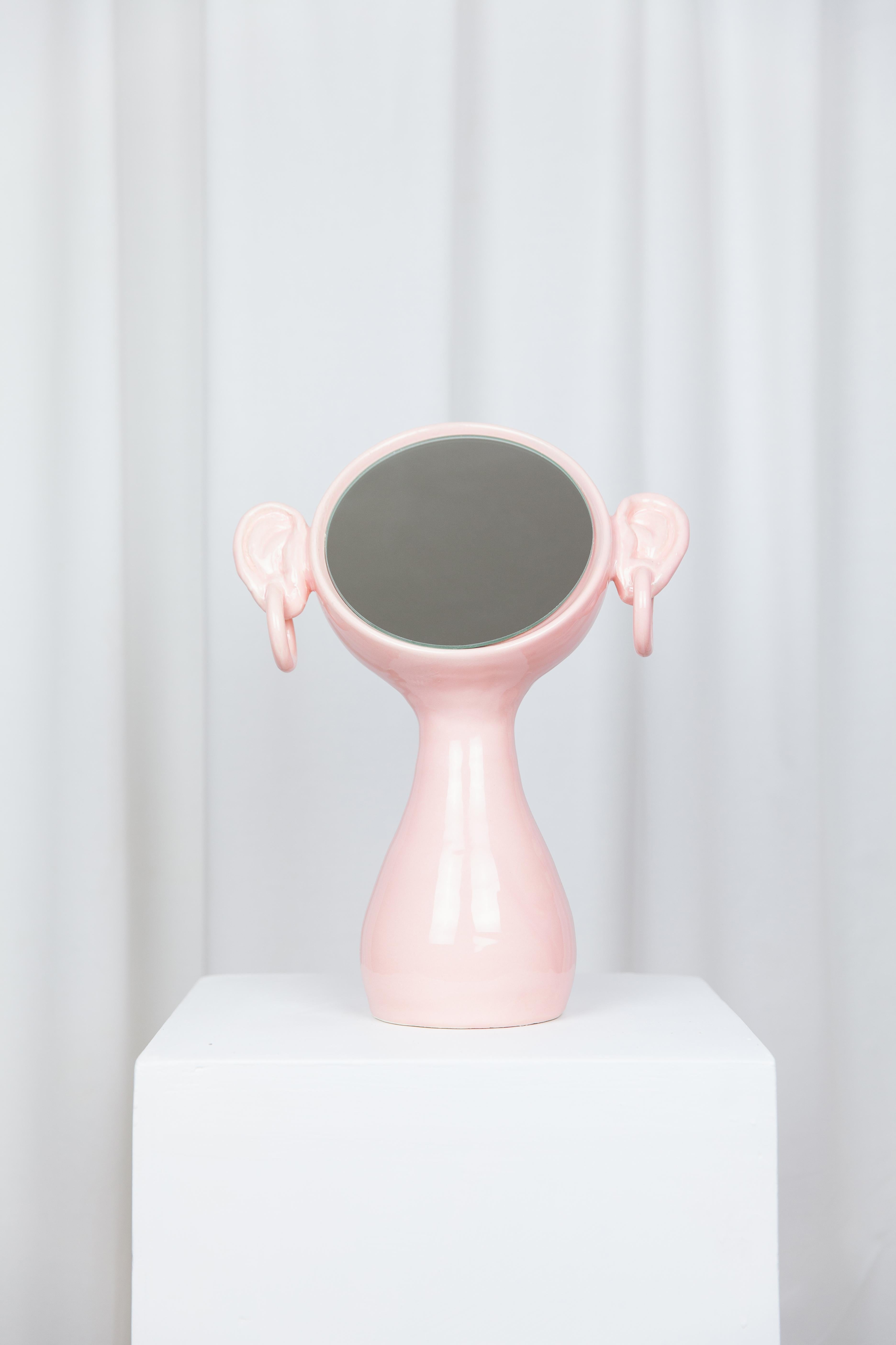 Ears mirror by Lola Mayeras
Dimensions: D 26 x W 12 x W 36 cm
Materials: Earthenware, mirror

Mirror in white earthenware, glazed in pink.
This piece is designed and handcrafted in the south of France.

Lola Mayeras — Designer 
In parallel