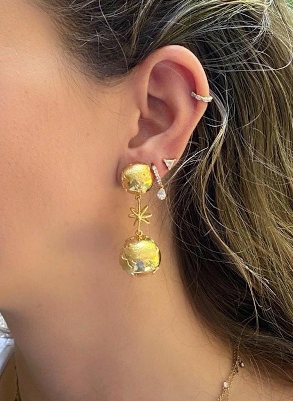 The Earth earrings are designed by Christina Alexiou. 

The Earth earrings are crafted with 18k yellow gold and handmade in Greece. 
The Earth is hollow, thus this pair of earrings is an easy to wear everyday piece of jewelry. This piece features