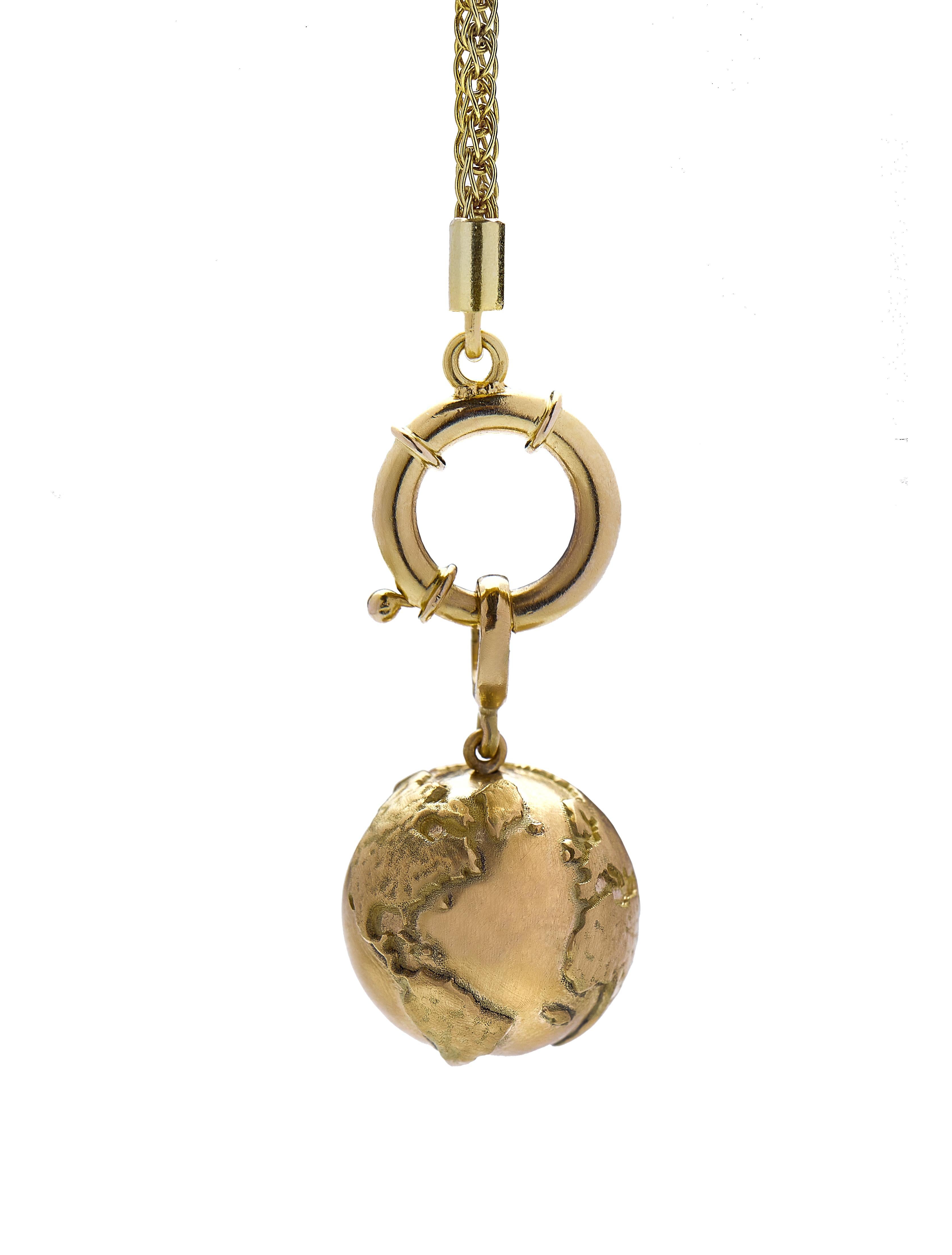 The Earth pendant is designed by Christina Alexiou.

The Earth pendant is crafted with 18k yellow gold and handmade in Greece.
The Earth is hollow, thus this pendant is an easy to wear everyday piece of jewelry. This piece features the element of