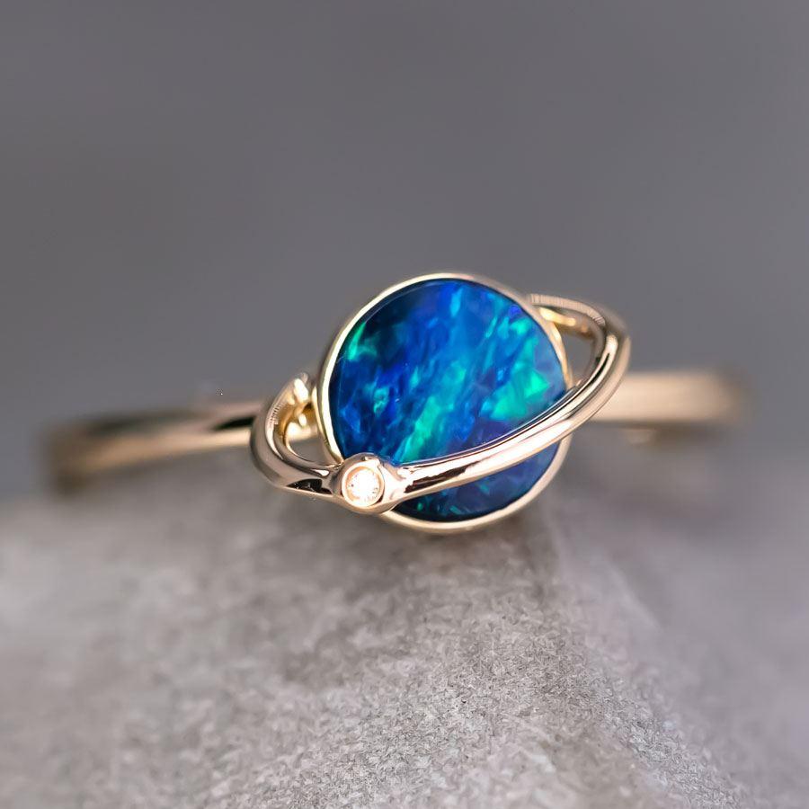Earth and Moon Design Australian Doublet Opal & Diamond Ring 18K Yellow Gold.


Free Domestic USPS First Class Shipping! Free Gift Bag or Box with every order!

Opal—the queen of gemstones, is one of the most beautiful gemstones in the world. Every