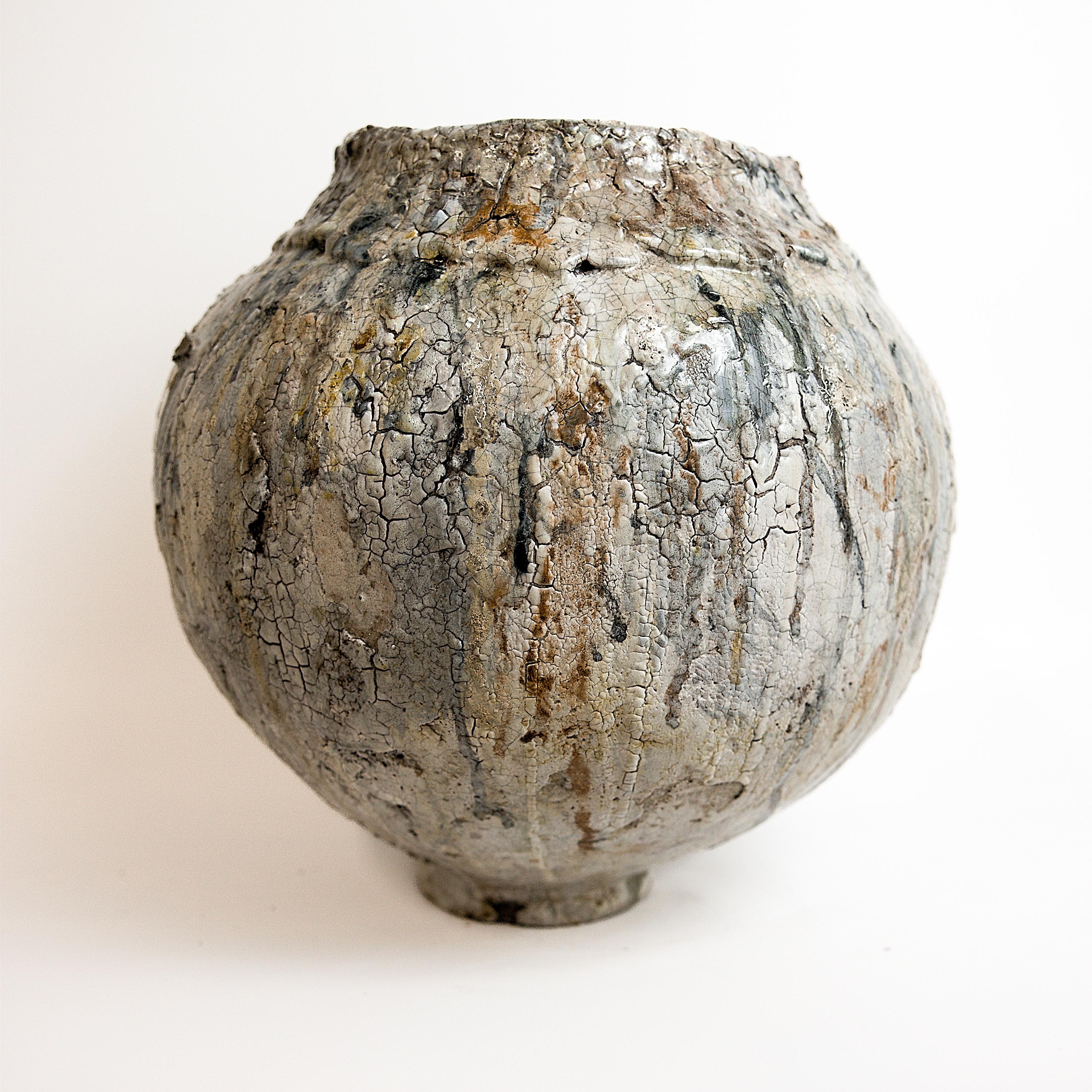 Covered in texture. multi layered glazing fired numerous times. this oversized centerpiece moon vase is glazed inside and can hold water.

 Measures : 13