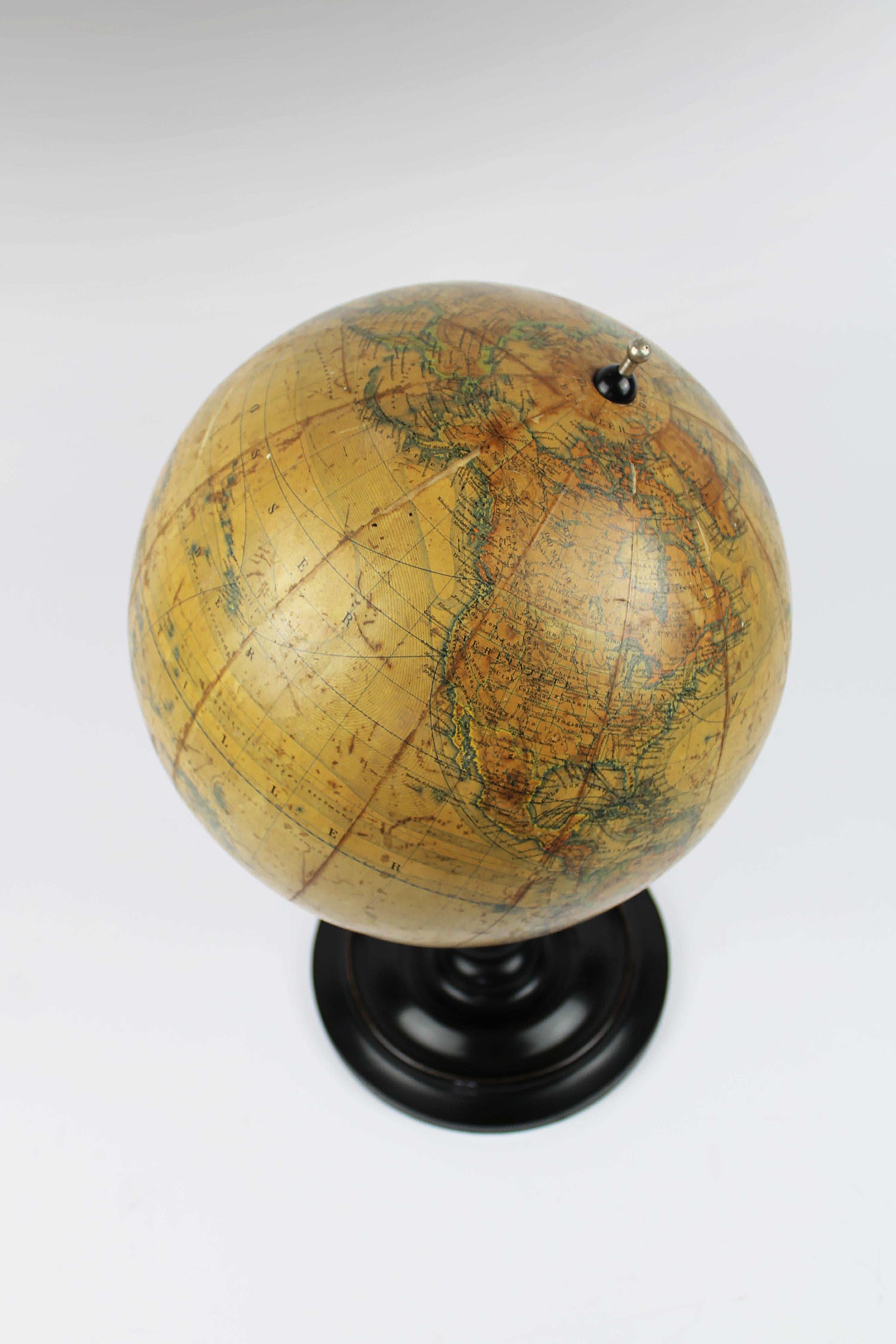 Presenting an exquisite Earth Globe by Ernst Schotte, meticulously hand-colored and crafted in 1895 in Berlin, Germany. This remarkable piece, known as 