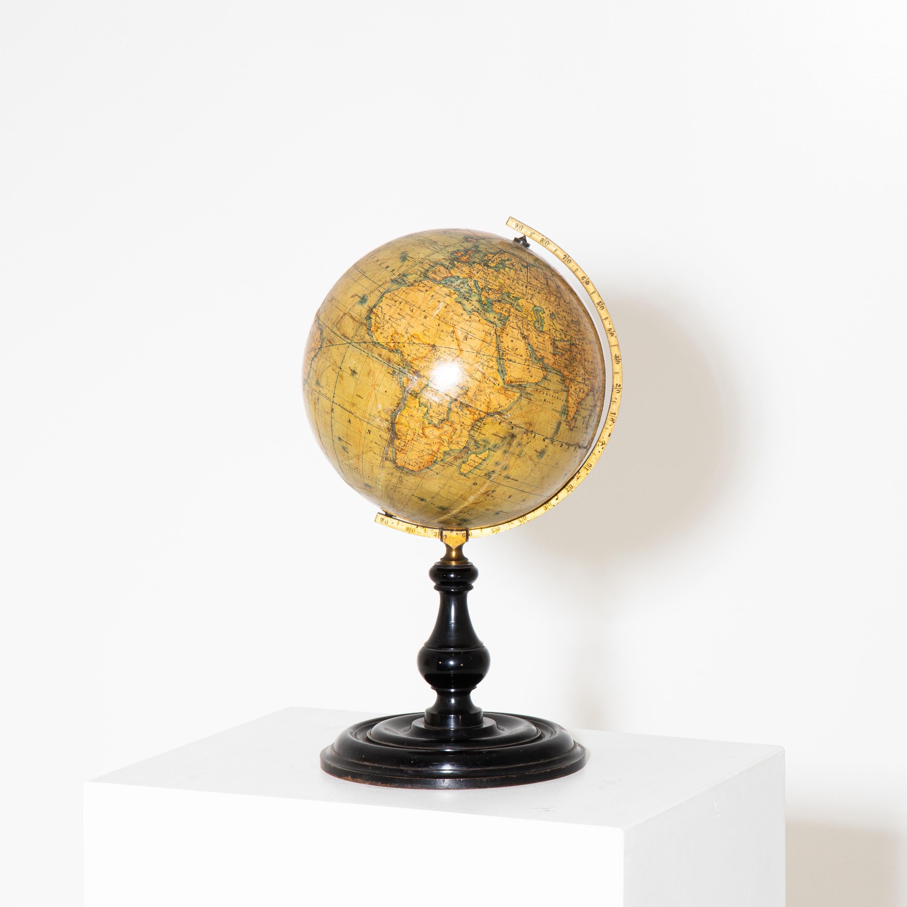 Earth globe with brass meridian on baluster-shaped base. Drawn by H. Kiepert Berlin.