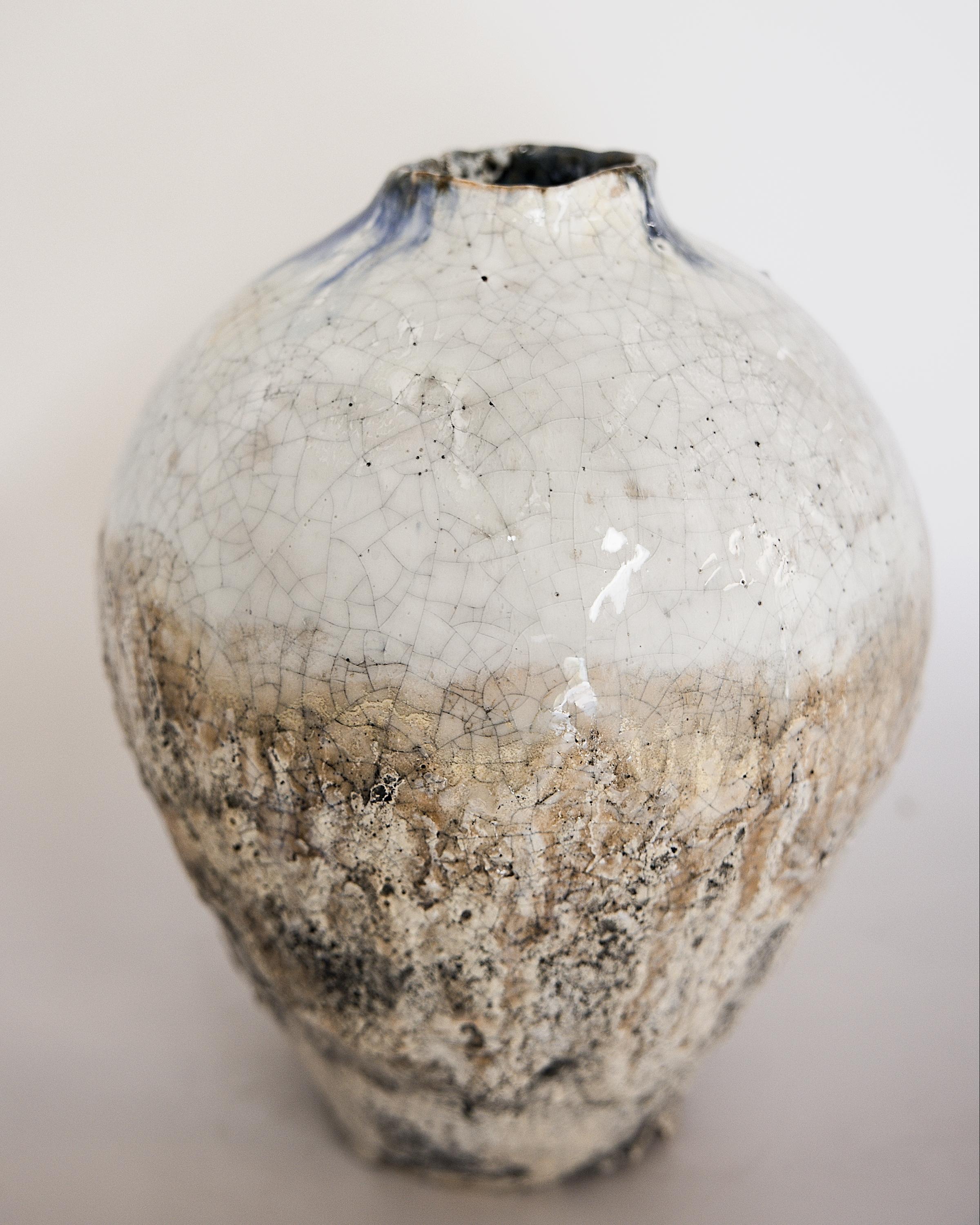 comes in Three sizes 
Vase 1: 10x8


this new line is Fresh nuetral  matte base with black cracks, Gloss white crackle glaze flowing on top

touch of navy oxidation on rim 

we love to create new modern organic textures on traditional shapes
please