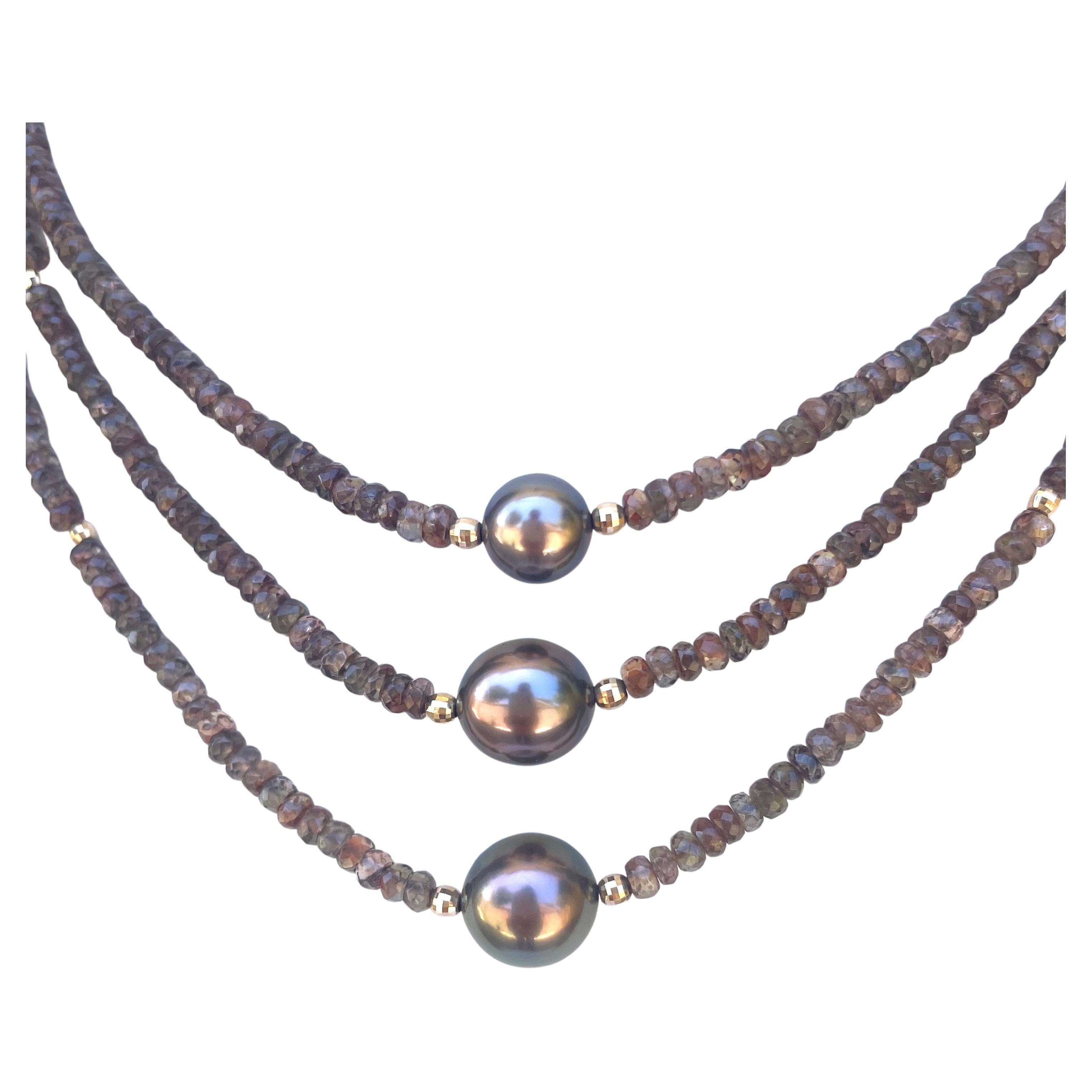 Description
Exquisite, rare Andalusite multi strand necklace in soft earthtones adorned with 3 exceptionally beautiful and rare copper color Tahitian pearls.
Item # N3744

Materials and Weight
Andalusite 4mm, 166cts, rondelle shape
Tahitian pearls