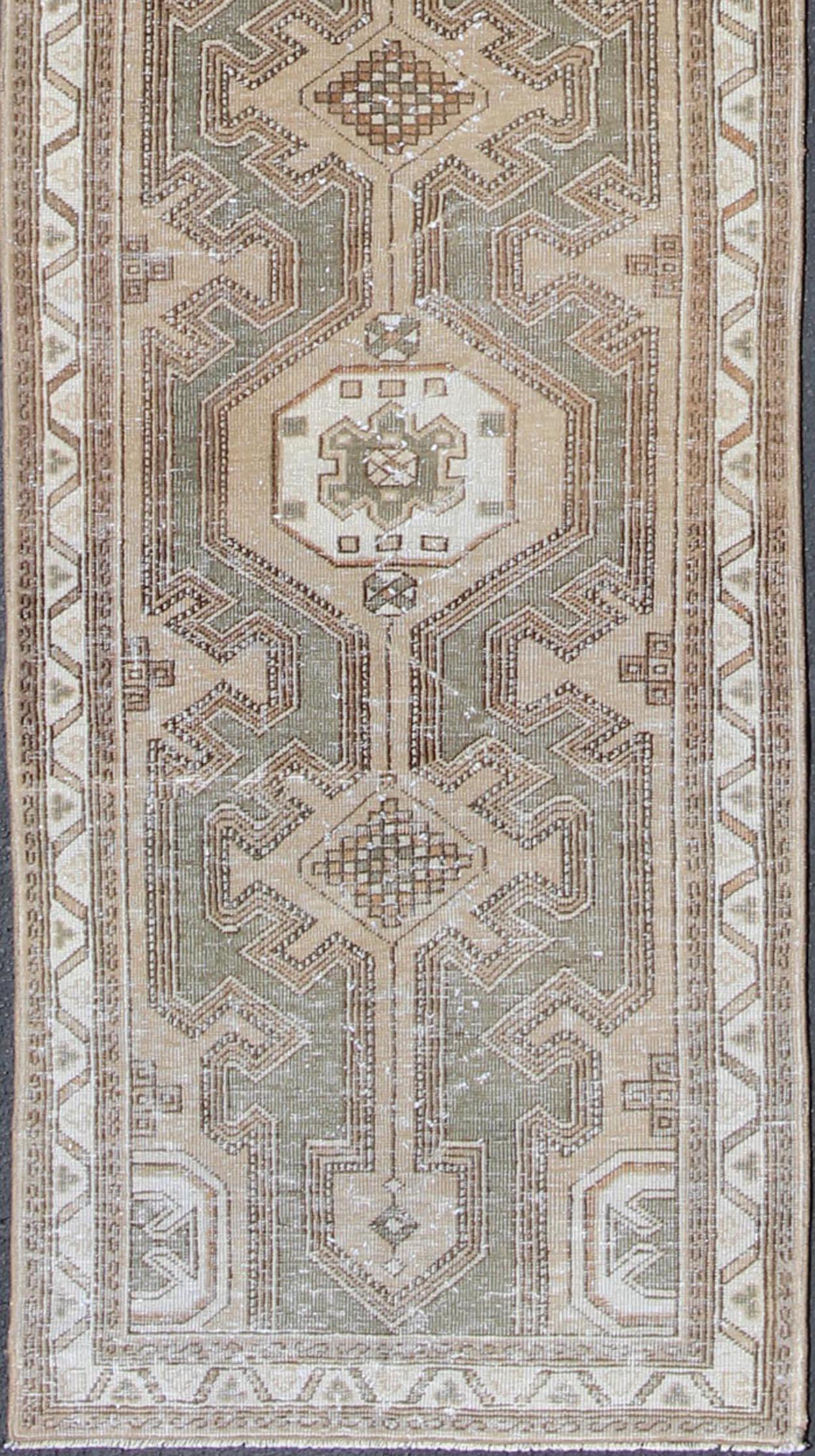 Serab antique runner from Persia with medallion design in earthy color palette, rug en-176214, country of origin / type: Iran / Serab, circa 1910.

This antique Serab runner is adorned with geometric-style medallions. Beautifully drawn ivory