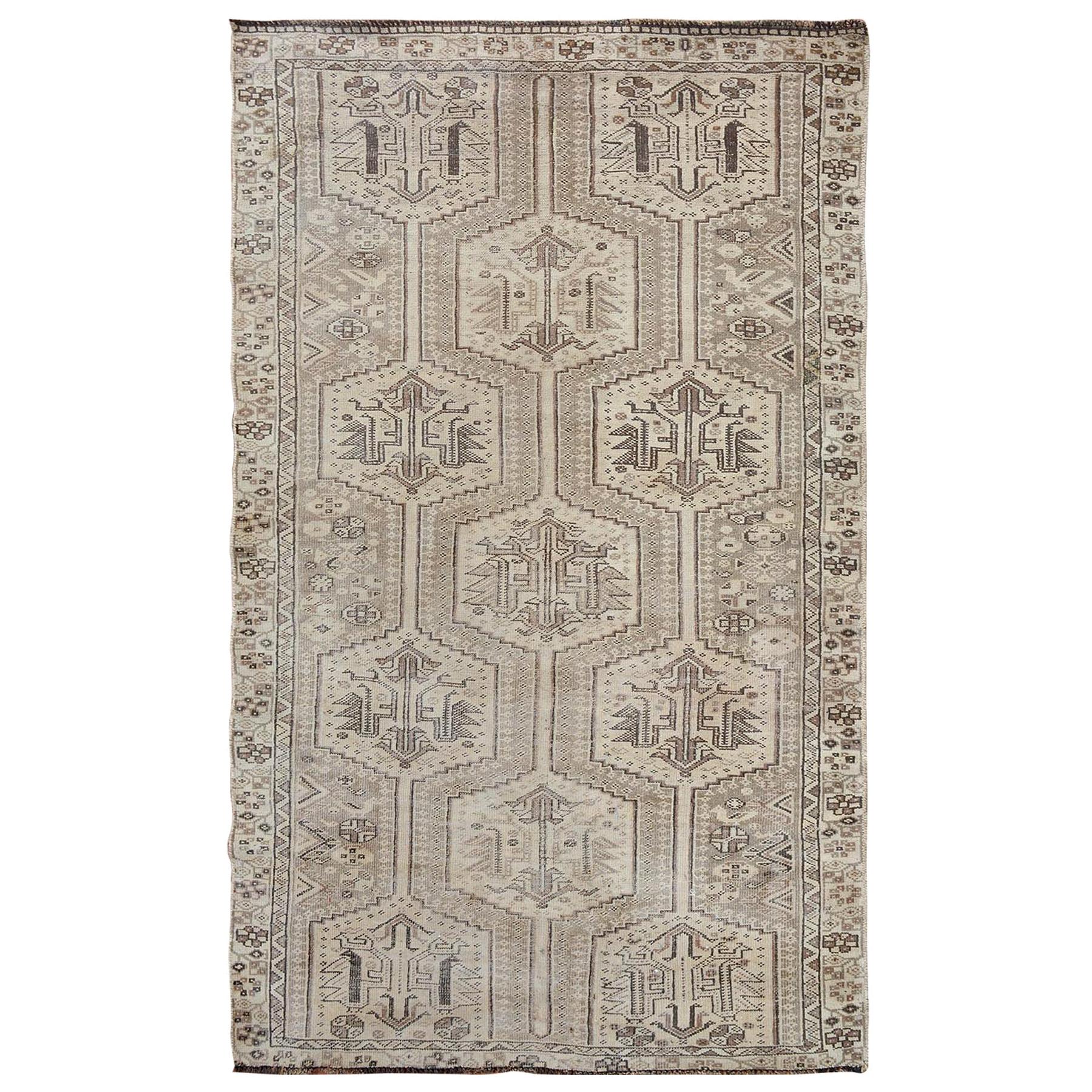 Earth Tone Colors Vintage and Worn Down Persian Shiraz Hand Knotted Oriental Rug For Sale