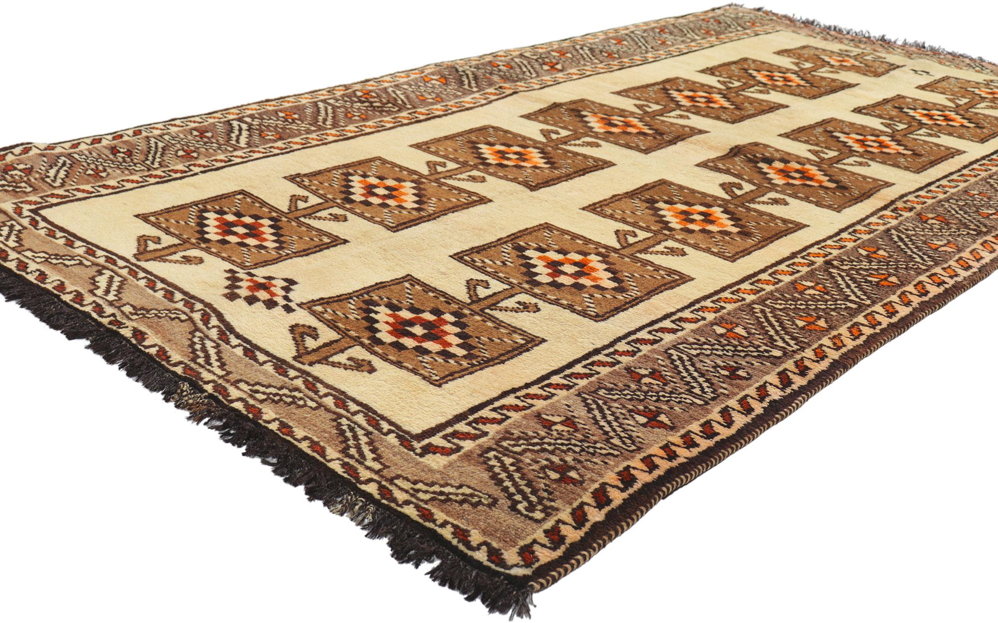 76548 Vintage Persian Shiraz Rug, 03'09 X 07'01. 
Emanating nomadic charm with incredible detail and texture, this hand knotted wool vintage Persian Shiraz rug is a captivating vision of woven beauty. The tribal design and earthy colorway woven