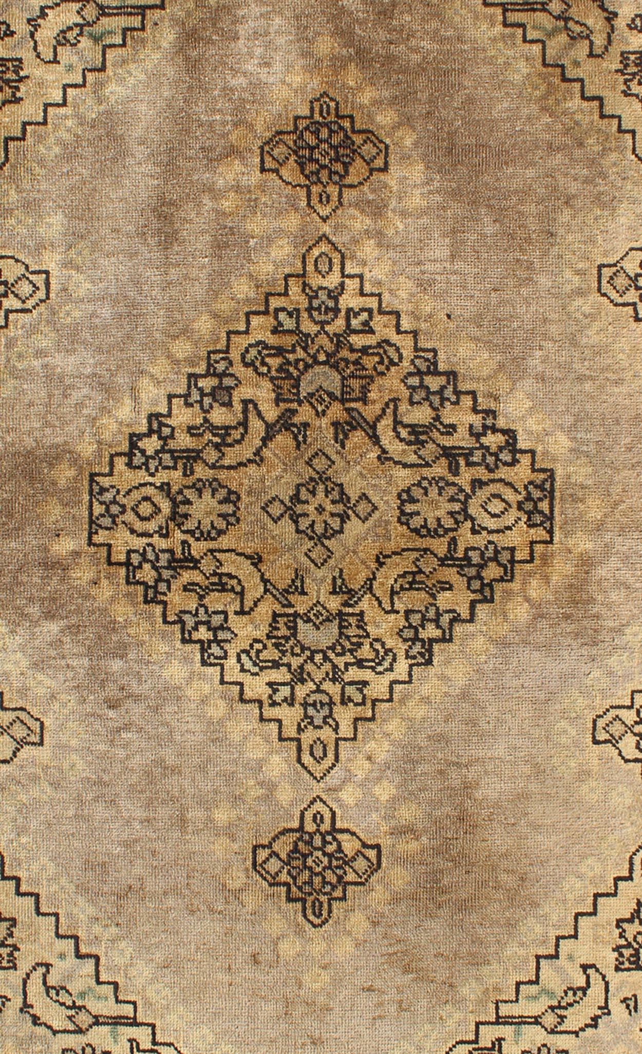 Medallion style Tabriz Persian vintage rug with swirling garden pattern. Keivan Woven Arts / rug H-102-39, country of origin / type: Iran / Tabriz, circa 1950
Measures: 3'3 x 5'0.
This spectacular Persian Tabriz bears a magnificent splendor