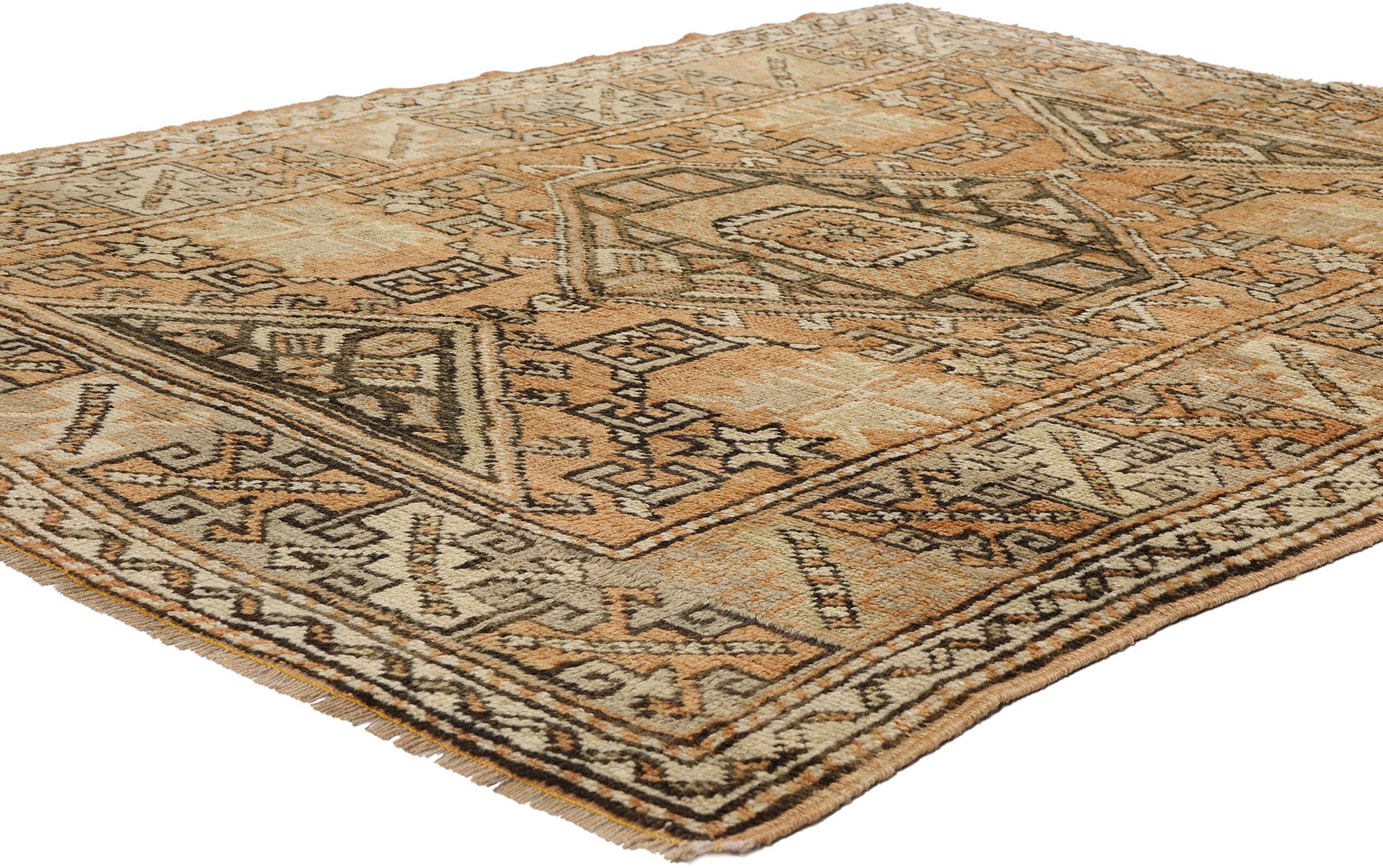 53900 Vintage Turkish Oushak Rug, 04'04 x 05'06. Marrying rustic Bohemian allure with nomadic charm, this hand-knotted wool Turkish Oushak rug delights with its earthy tones and intricate tribal motifs. Anchoring its design is a mesmerizing hooked