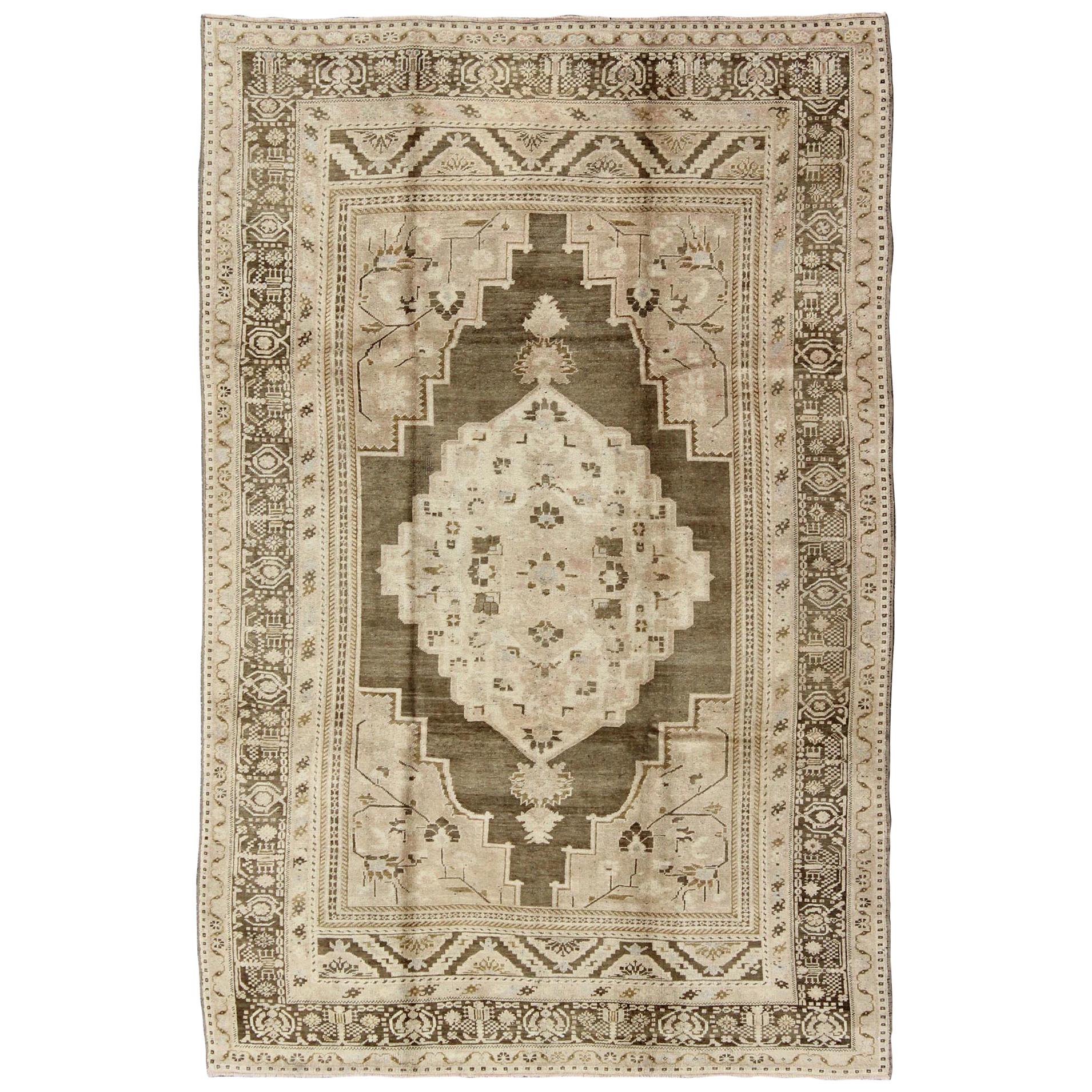 Earth Tone Vintage Turkish Oushak Rug with Tribal Geometric Designs For Sale