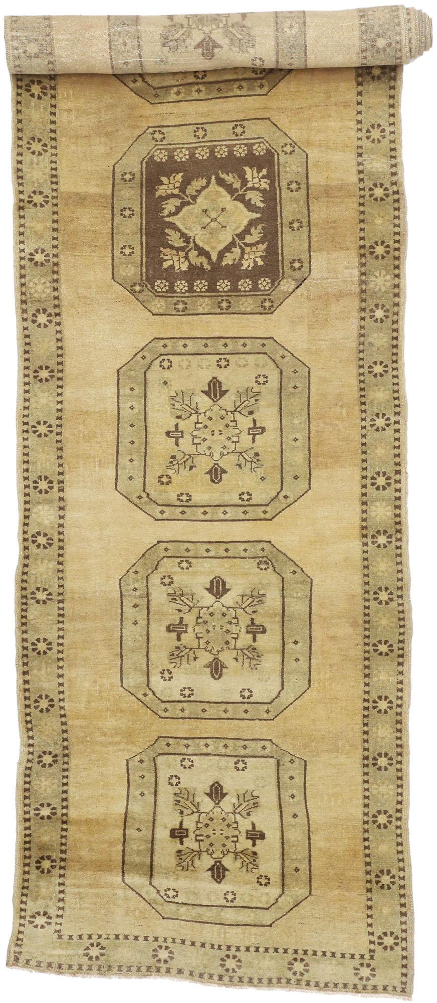 50146 Vintage Turkish Oushak Rug, 03’09 x 15’01. 
Bucolic charm meets imitable warmth in this vintage Turkish Oushak rug The delicate botanical design and golden earthy hues woven into this piece work together creating a luxurious yet modern look.