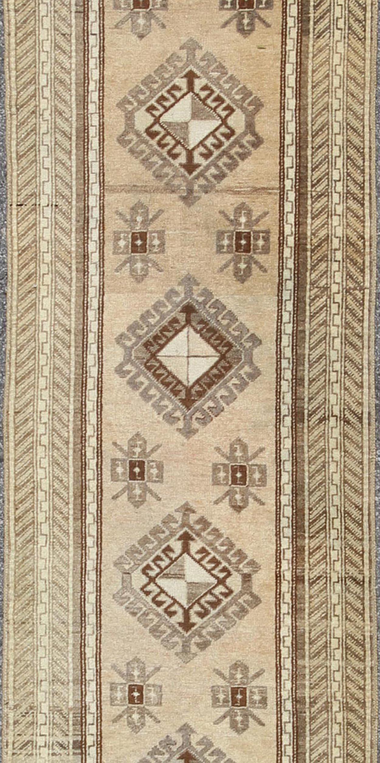 Earth-Toned Vintage Turkish Oushak Runner with Stacked Medallion Design In Good Condition For Sale In Atlanta, GA