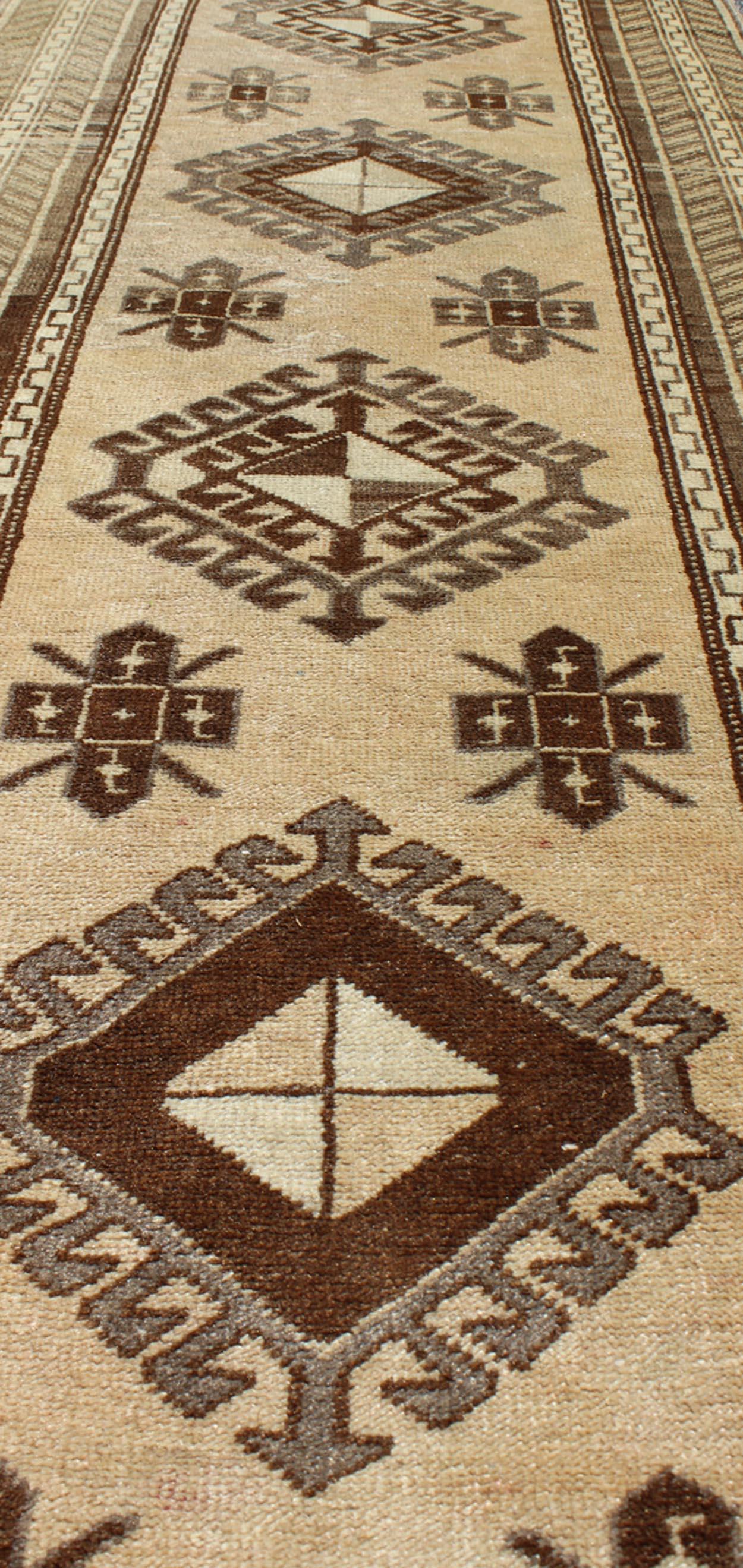 Wool Earth-Toned Vintage Turkish Oushak Runner with Stacked Medallion Design For Sale
