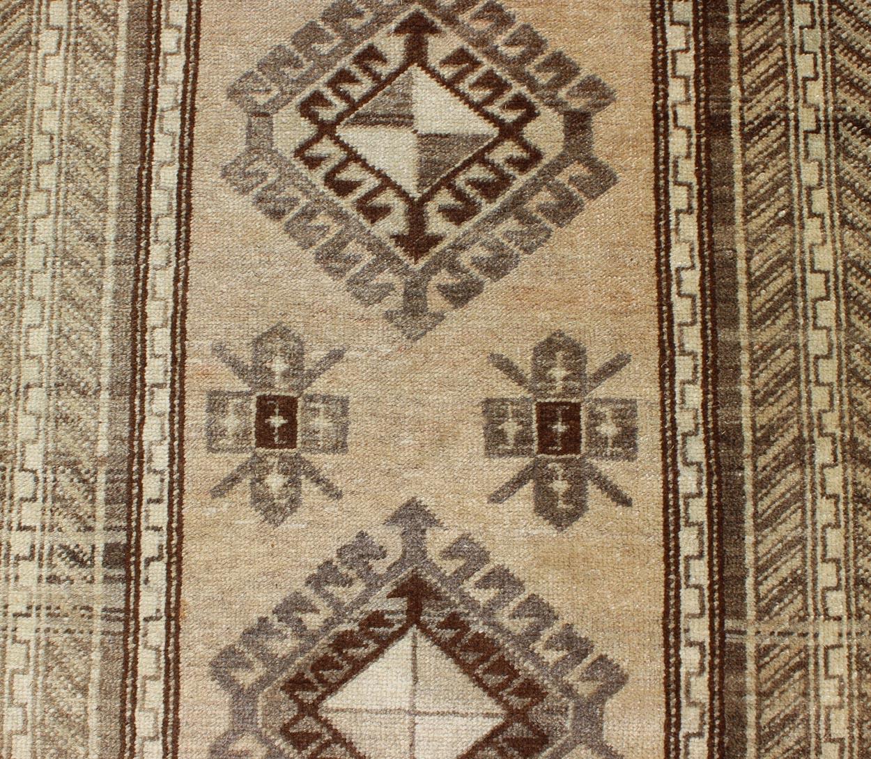 Earth-Toned Vintage Turkish Oushak Runner with Stacked Medallion Design For Sale 1