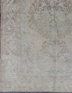 Earth Tones Antique Turkish Oushak Rug with Faded Colors in Medallion Design