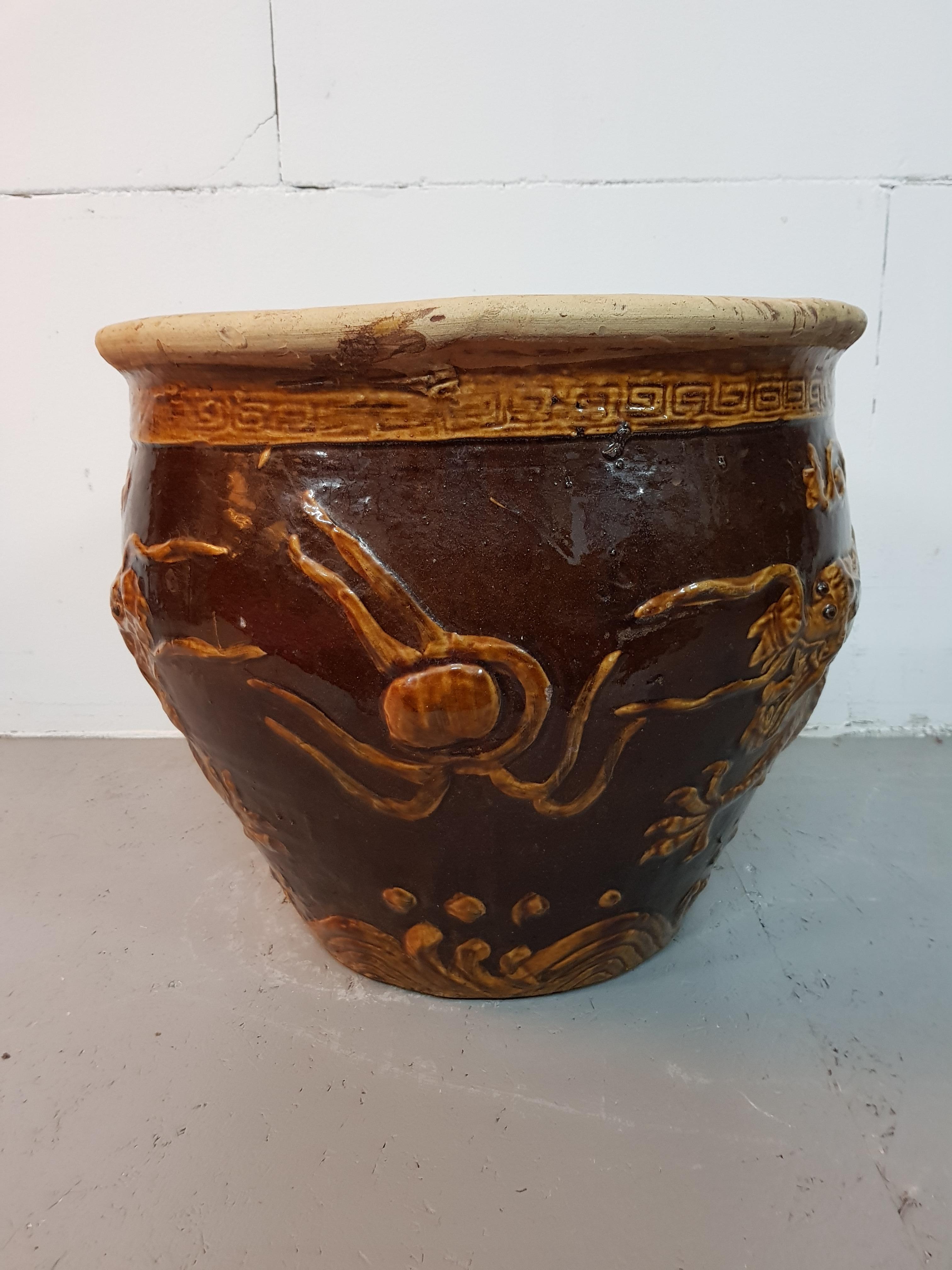 Chinese Earthenware Planter with Relief of Dragons, Second Half of the 20th Century For Sale
