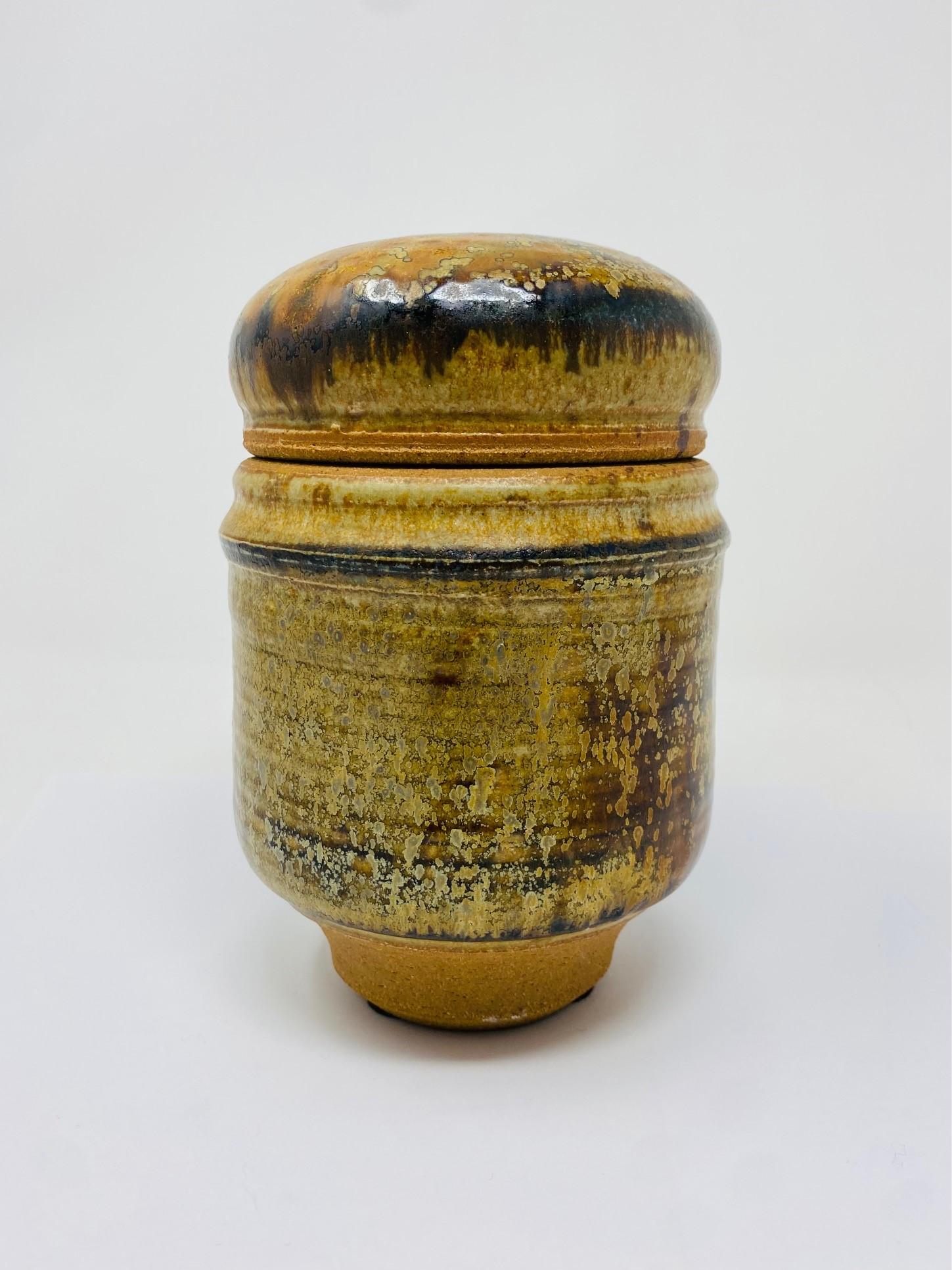 Incredible Mid-Century ceramic piece. Beautiful crafted ceramic jar with lid nice glaze and condition, no chips or cracks, classic California pottery circa 1970's.  Signature unknown.

Mid-Century, Hollywood Regency, Art Deco, Eclectic, Coastal,