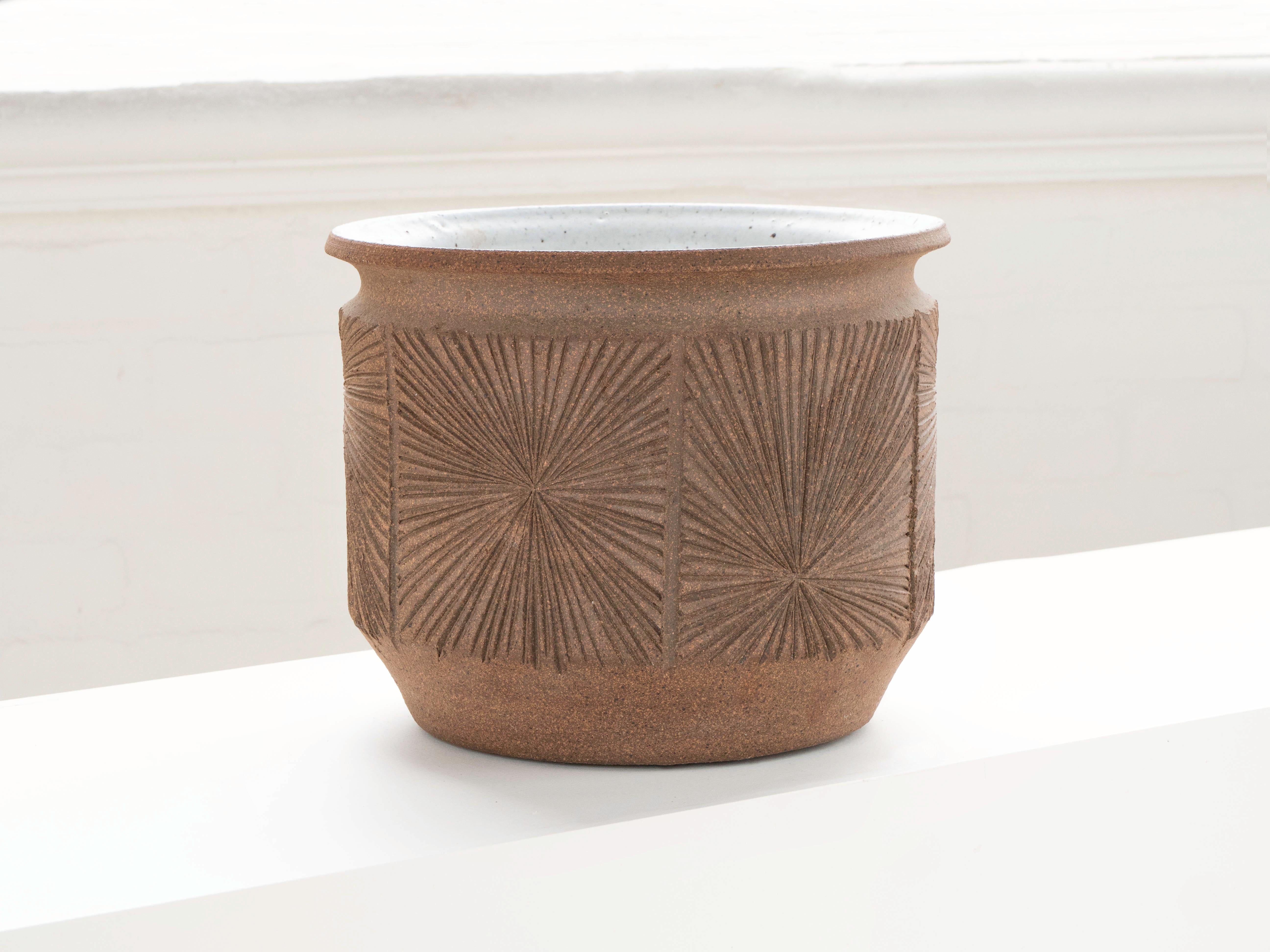 A mid century modern planter by Earthgender.  David Cressey & Robert Maxwell circa 1970's. This piece has hand tooled incisions on the outside forming a pattern referred to as the 
