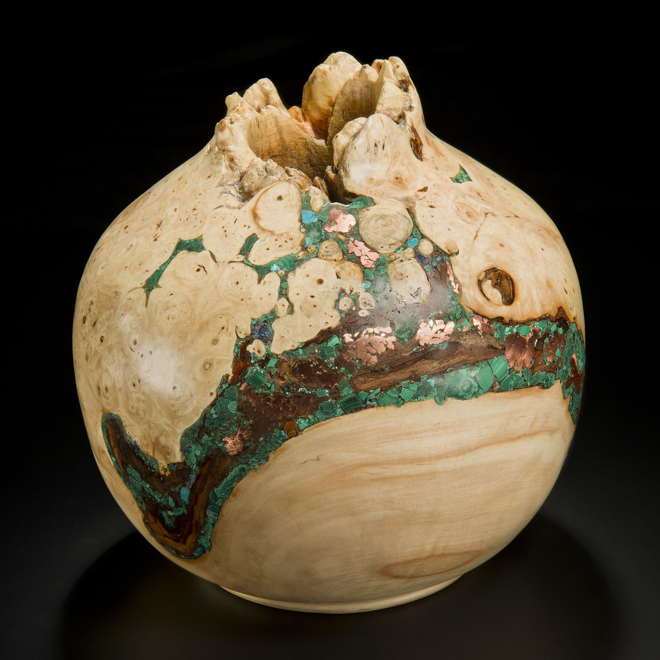 ‘Earthly Treasures No 23’ is a unique sculptural bowl by the British artist, Morrison Thomas. It is made from burred Horse Chestnut inlaid with Native Copper, Malachite & Chrysocolla.

Morrison turns beautiful wooden spheres from damaged or