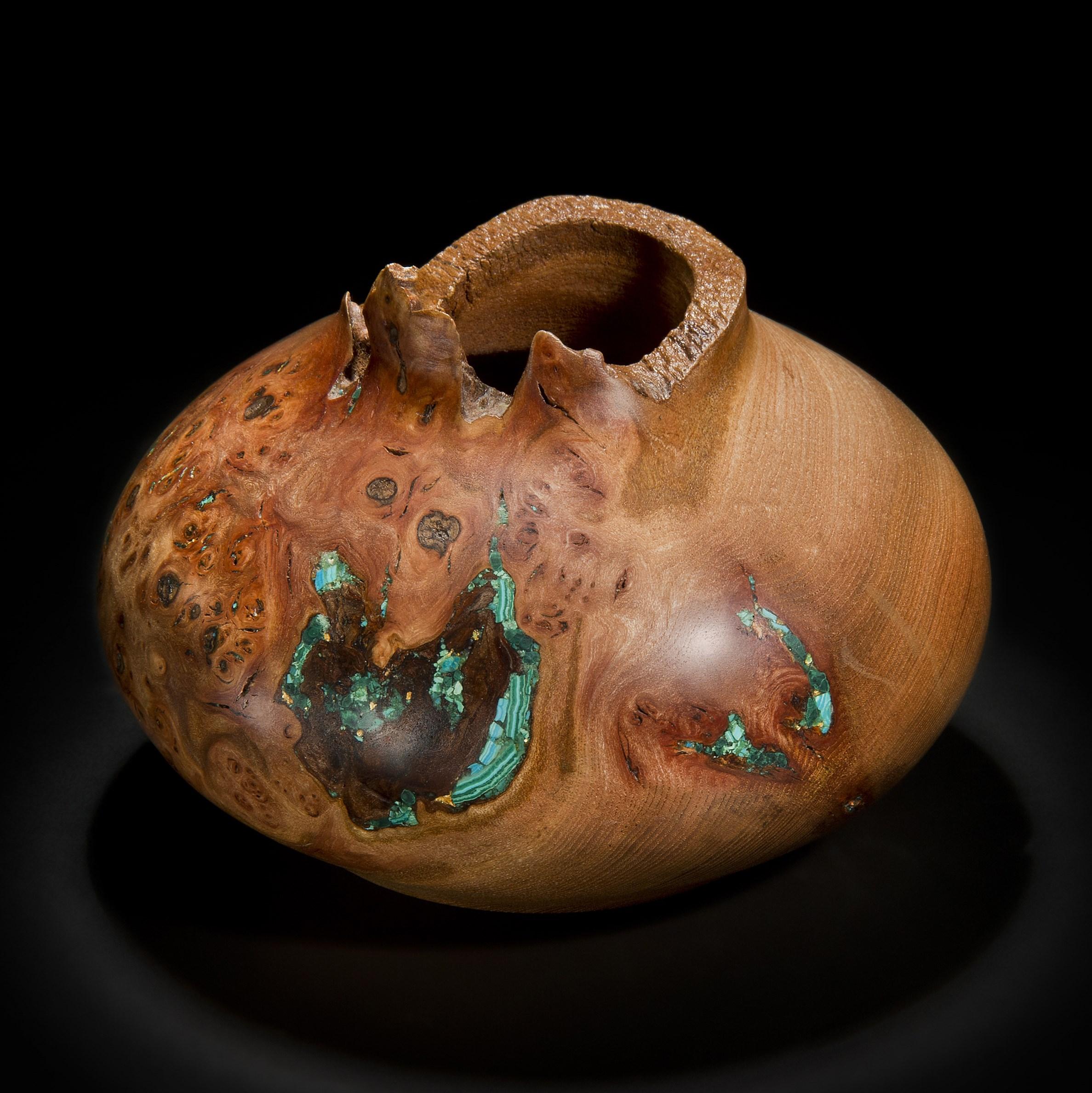 ‘Earthly Treasures No 28’ is a unique sculptural bowl by the British artist, Morrison Thomas. It is made from burred English Elm inlaid with Chrysocolla, Malachite, Gold and Turquoise.

Morrison turns beautiful wooden spheres from damaged or