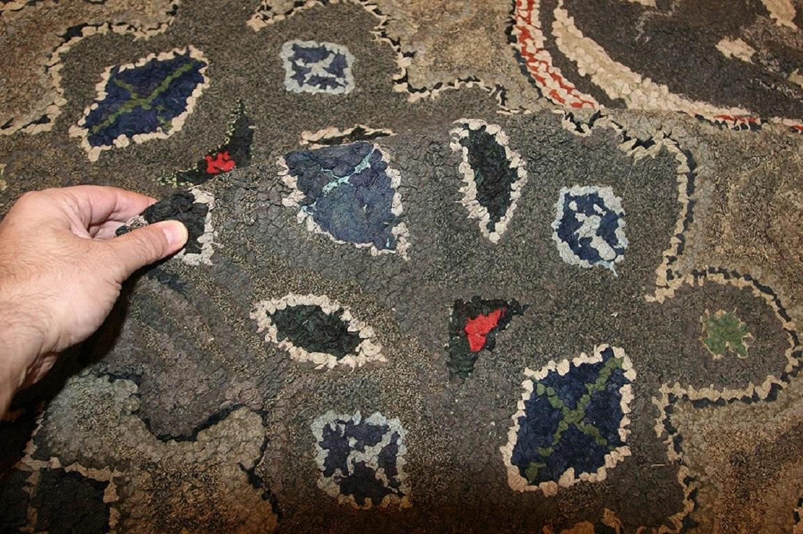 Antique hooked rug, country of origin: United States, circa 1920. Size: 6 ft 6 in x 8 ft 9 in (1.98 m x 2.67 m)

This attractive antique rug from the United States showcases a vista of freshly mined geodes. The earthy landscape of slate, stone and