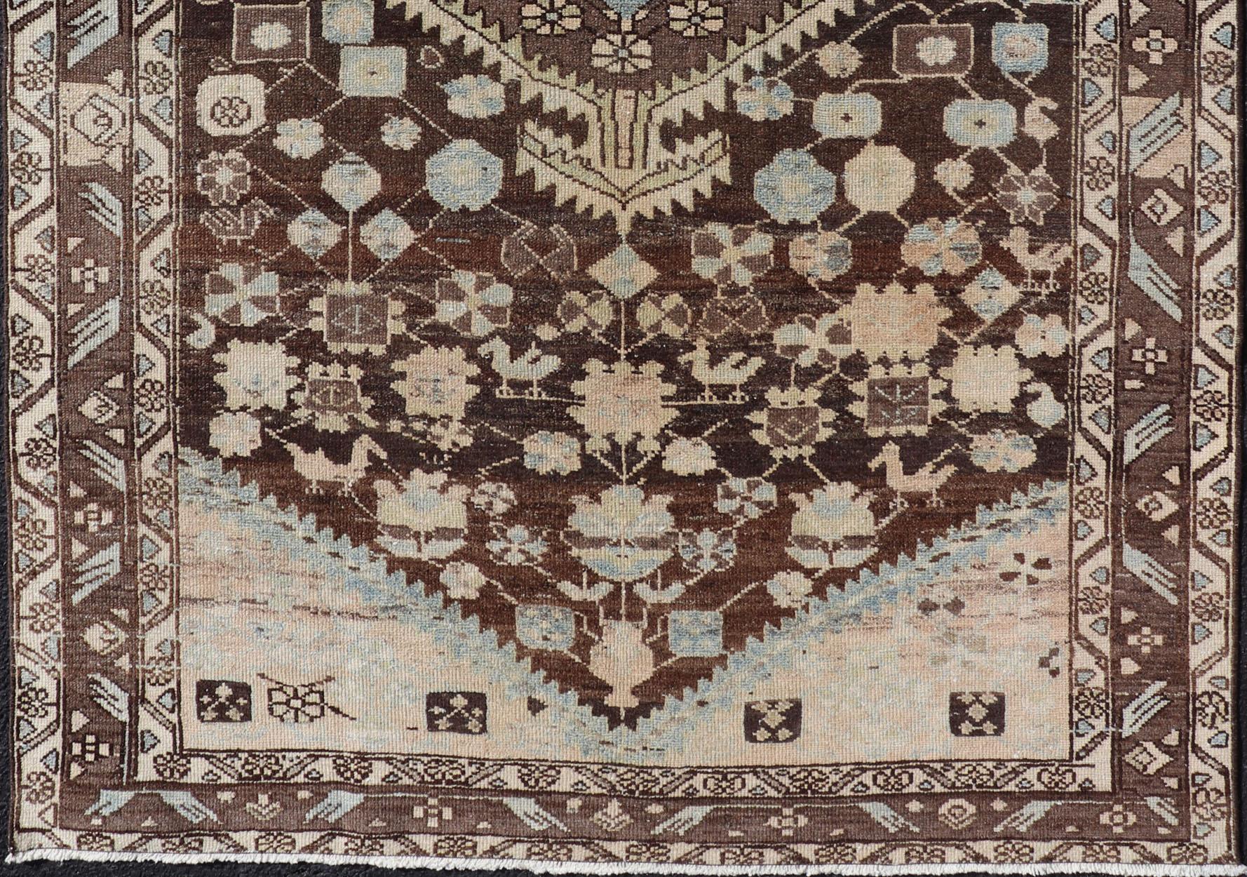 Floral design malayer vintage rug in brown and light grayish-blue color tones, Keivan Woven Arts / rug EMB-9547-P13075, origin / type: Iran / Hamedan, circa 1930

This beautiful vintage malayer rug from Persia features an elaborate medallion
