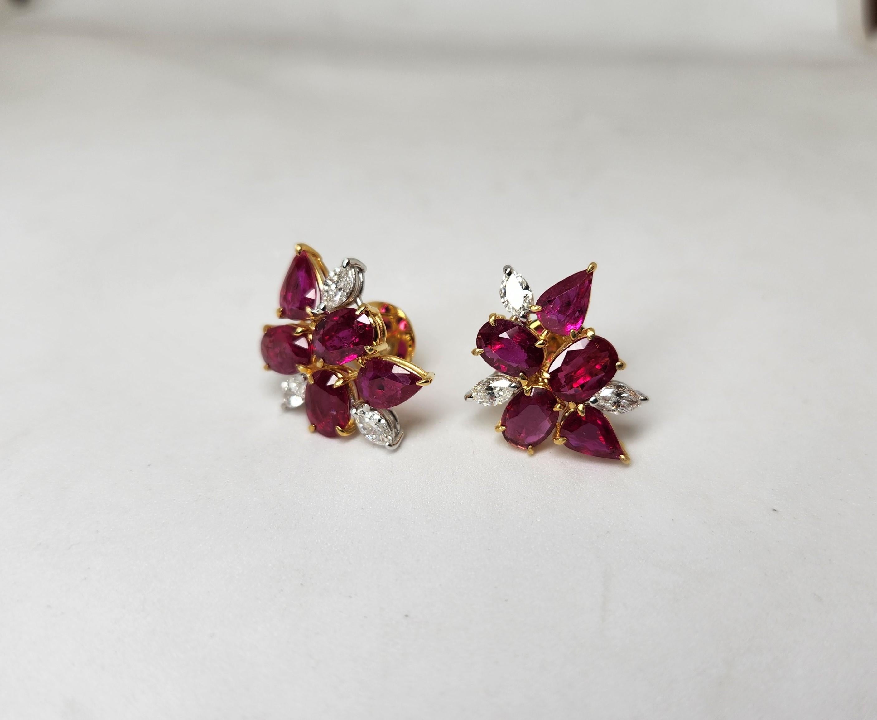 10 Mozambique rubies set with diamonds delicately  crafted in yellow gold.
10 Rubies 7.32 carats
6 Diamond marquise 0.91 carats
18 karat gold 6.22 grams