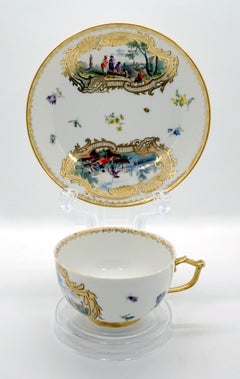 Eary 19th Century Meissen Cup and Saucer with Kauffahrtei Scenes and Gold Decor