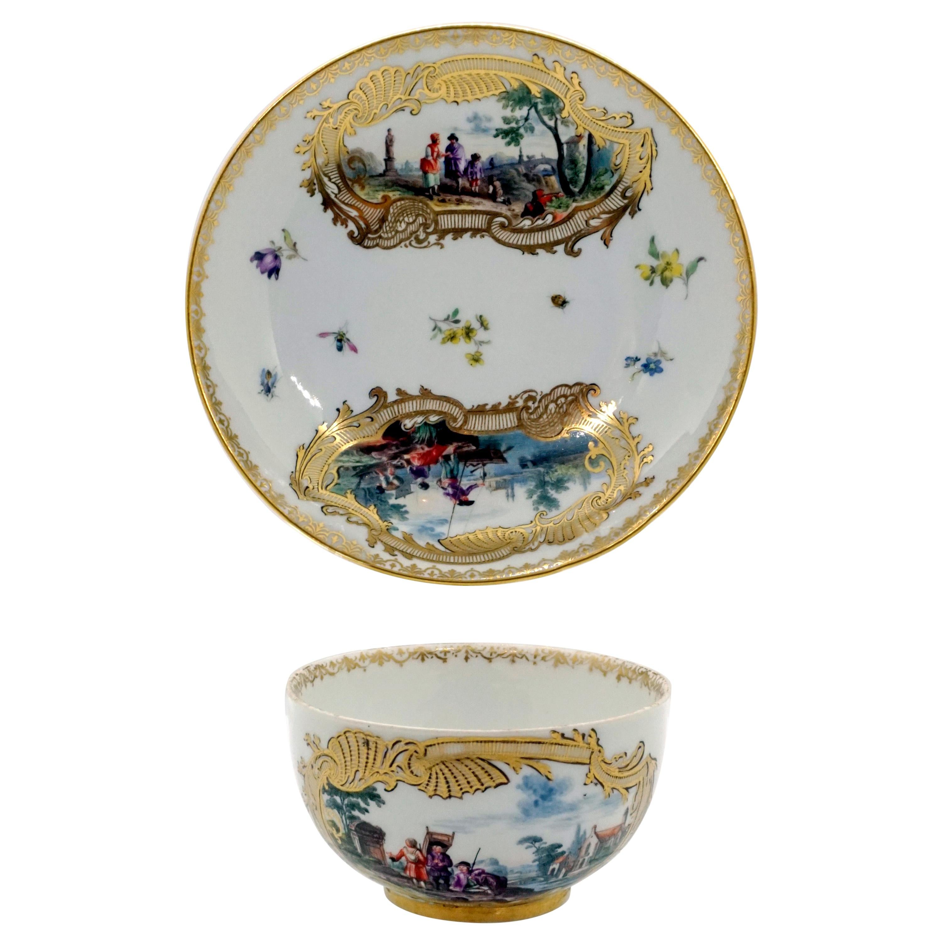 Eary 19th Century Meissen Cup and Saucer with Kauffahrtei Scenes and Gold Decor