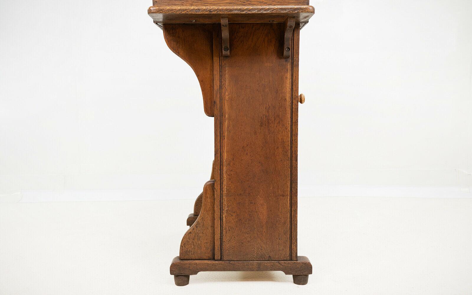 Teachers lectern

An early 20th century oak headteachers lectern. The podium has a flip-top desk with internal storage to the top and rear.

Featuring a single brass-capped ink well with the makers name present, made by the Bennet furnishing