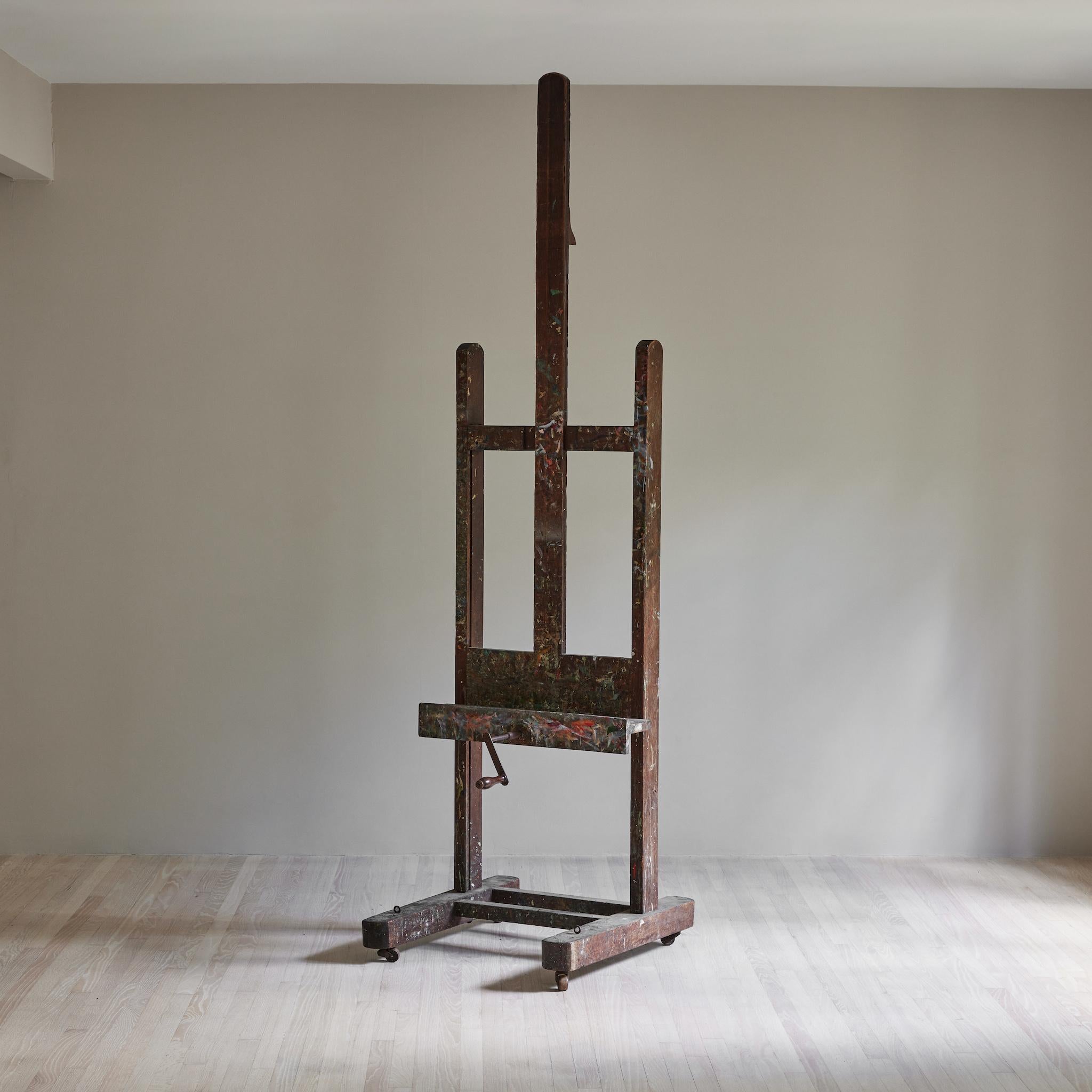 Easel in oak with a wonderful patina due to use with multiple paint colors. Extends to 114 inches.