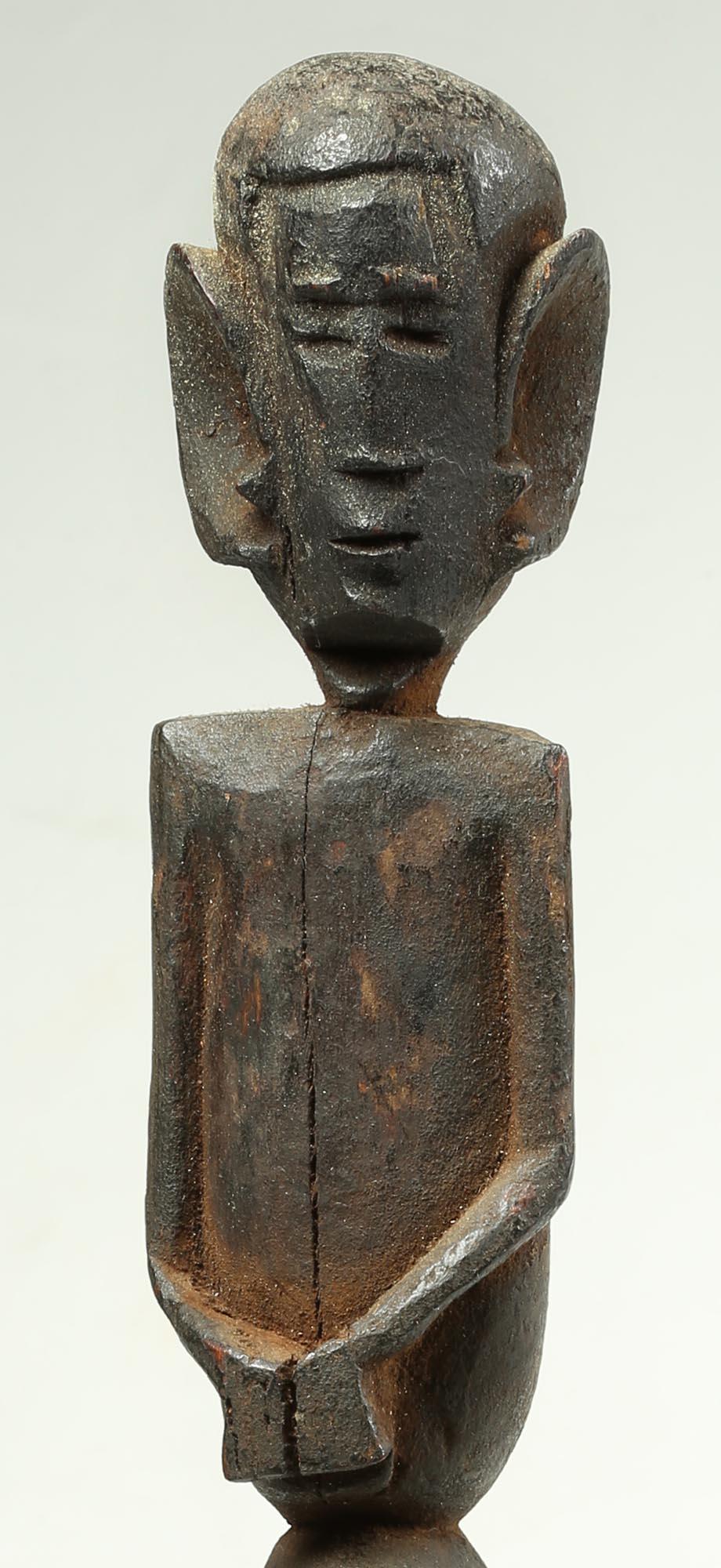 Zigua people, early double figure prestige or magical staff with large ears, one figure on top of other, early 20th century, Tanzania. A striking dance or prestige staff with haunting figures and exaggerated features. 18 3/4