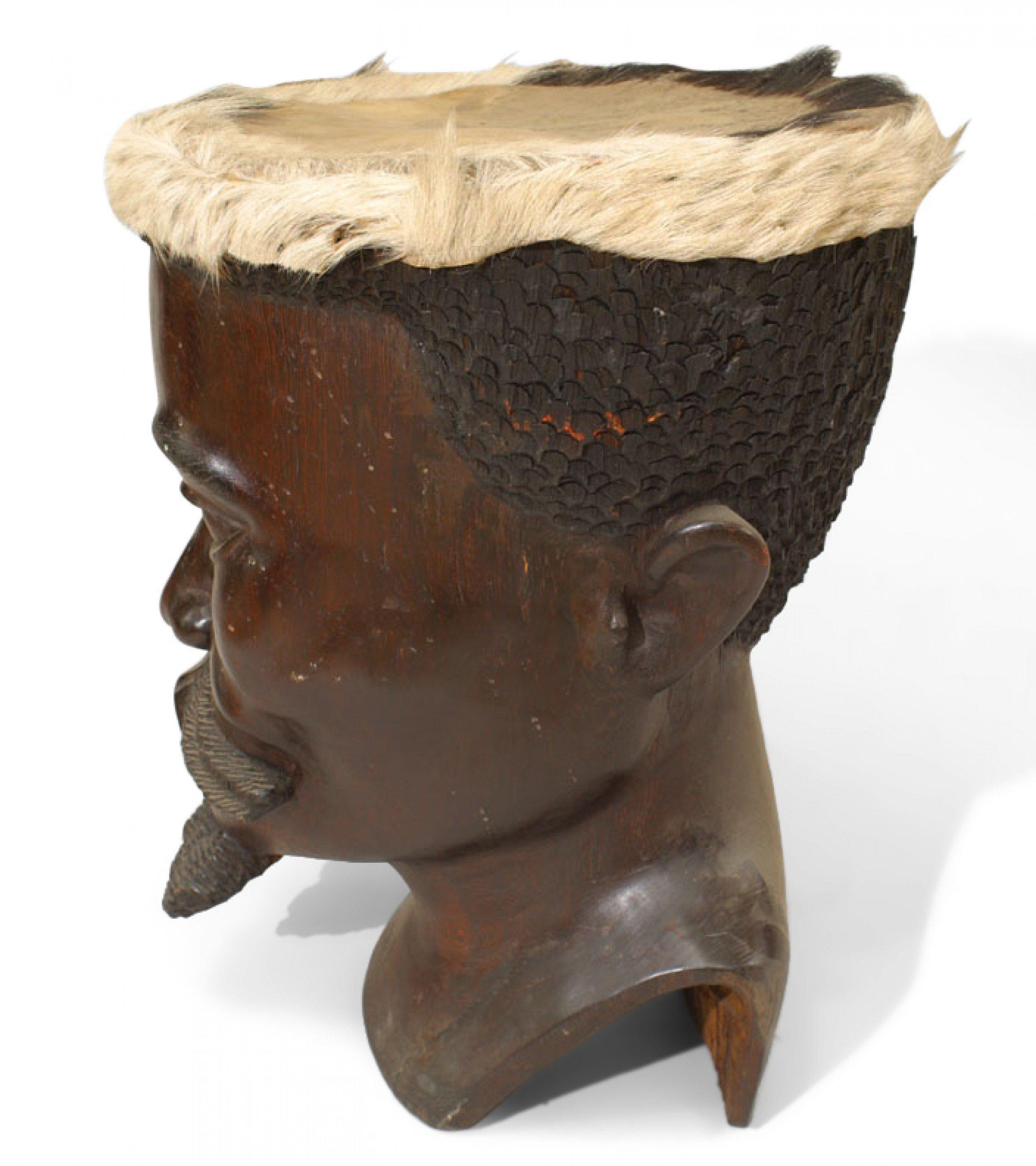 East African (20th Century) drum of carved head of man with beard and skin top, signed.
 