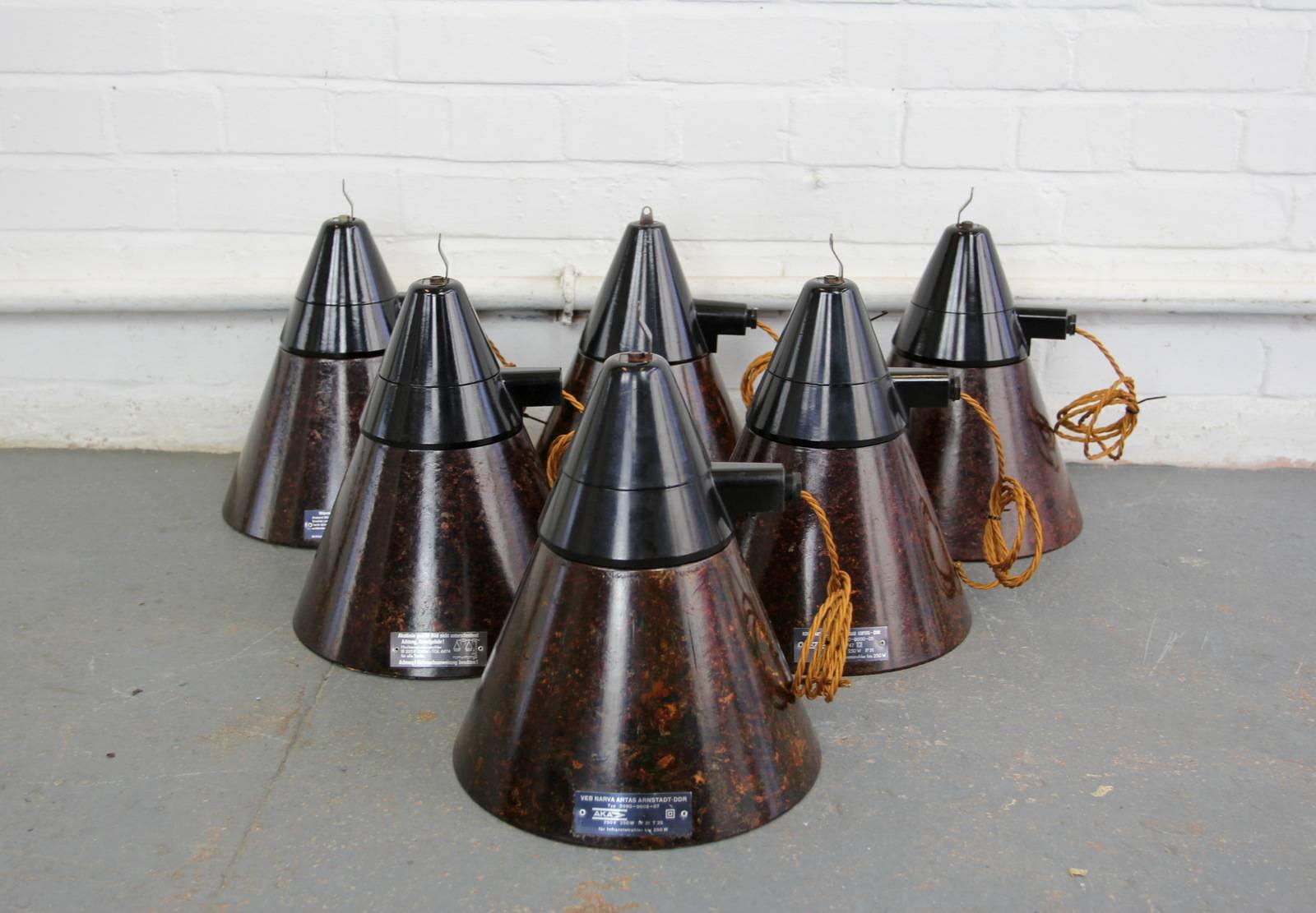 East German bakelite conical factory lights, circa 1950s

Product code #OA476

- Price is per light (12 available)
- Mottled bakelite shade 
- Black bakelite tops
- Takes E27 fitting bulbs
- Comes with 100cm of braided cable
- Comes with