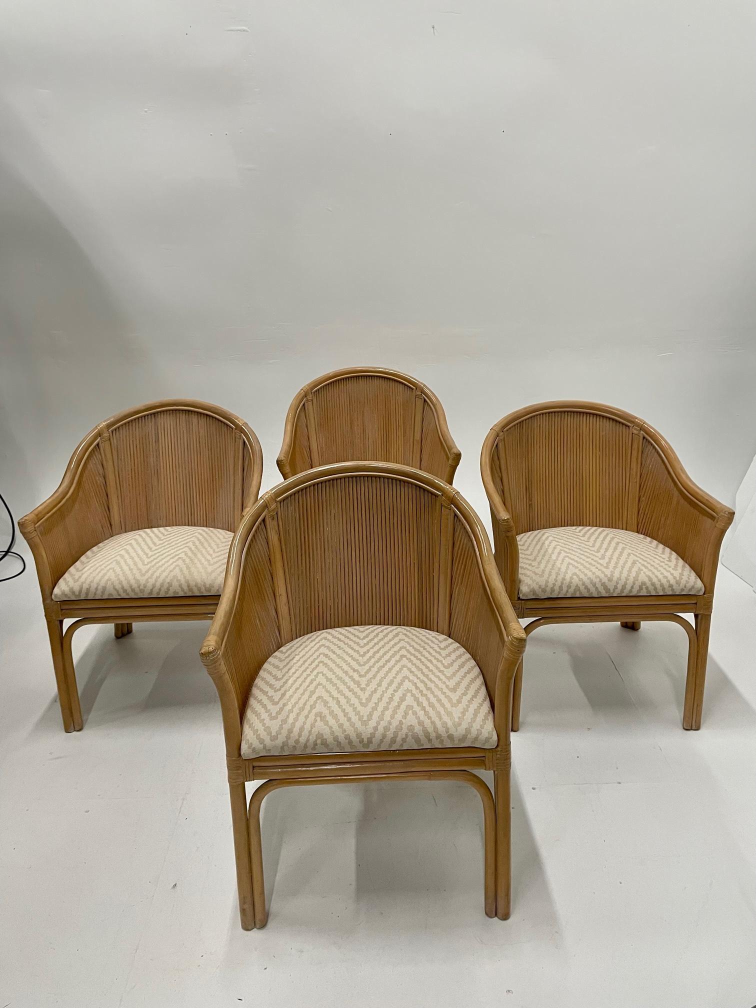 Chic set of 4 barrel back McGuire armchairs, perfect for dining or livingroom, having stunning mix of natural honey colored rattan parquetry & bamboo and cream and taupe zigzag upholstered seats.
Upholstery is new Old World Weavers fabric.
