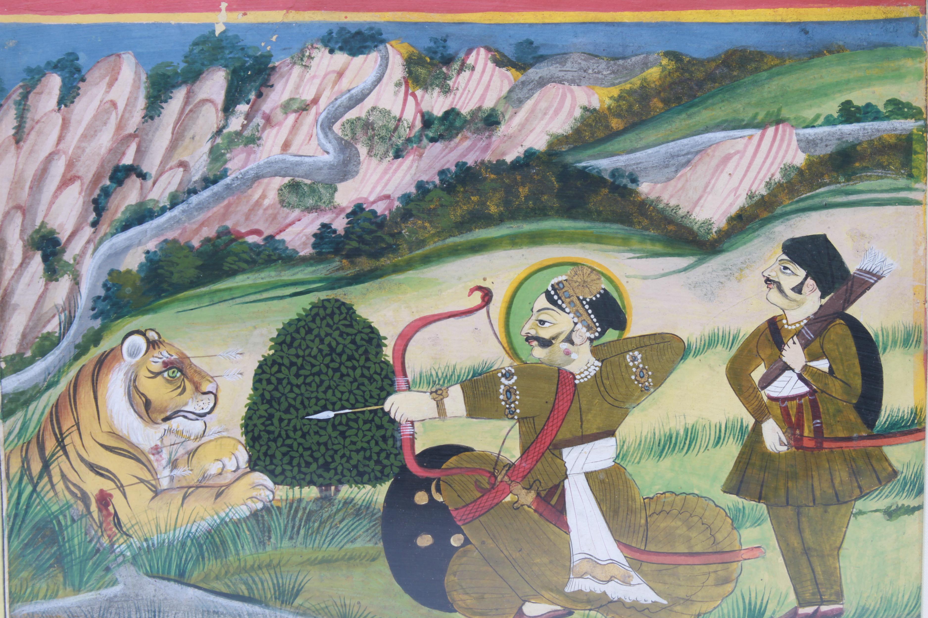 Eastern Indian framed gouache on paper painting depicting an archer and his servant, with bow and arrow, aiming at a wounded tiger with a landscape. The piece is framed and in good vintage condition.