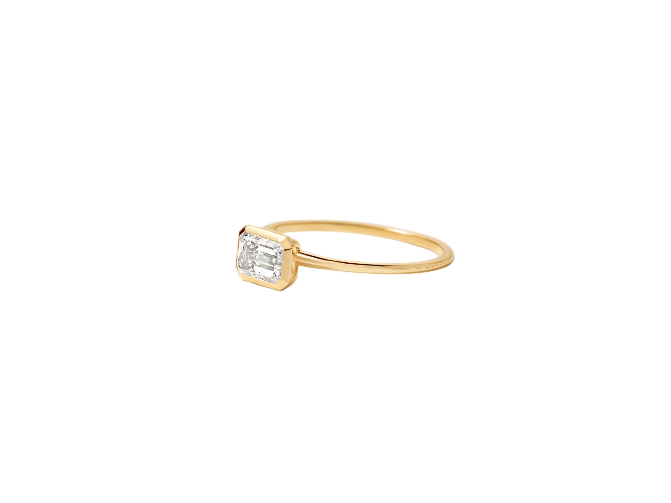 East to West emerald cut moissanite ring. Horisontal emerald moissanite ring. Delicate 14k gold ring with emerald cut moissanite. Emerald moissanite 14k gold ring. Moissanite solitaire ring. Plain moissanite ring. Diamond cut moissanite ring.