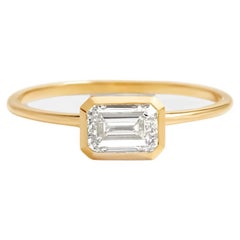 Used East to West emerald cut moissanite ring