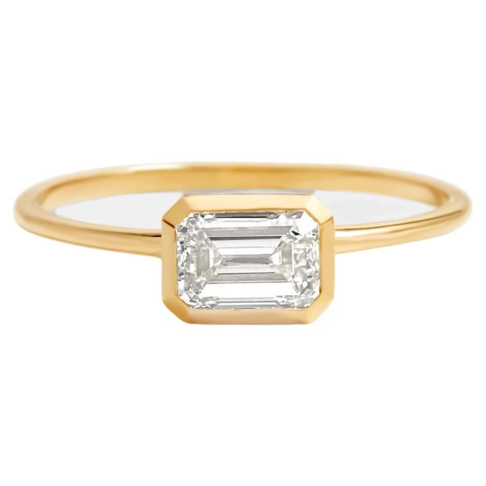 East to West emerald cut moissanite ring. 