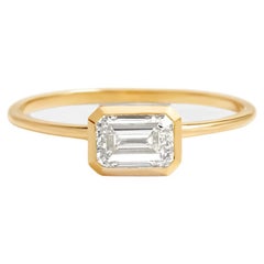 Used East to West emerald cut moissanite ring. 