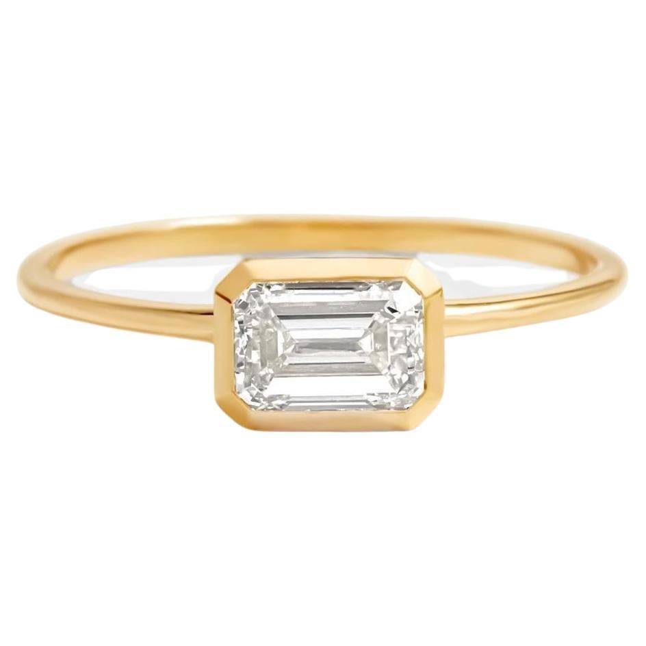 East to West emerald cut moissanite ring