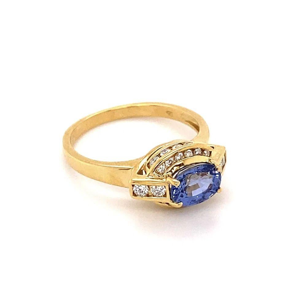 Simply Beautiful! Finely Detailed East Sapphire and Diamond Hand-crafted Vintage Show Stopper Gold Ring. Centering an Awesome Oval 0.70 Carat Blue Sapphire, Hand set east to west. Surrounded by Diamonds, weighing approx. 0.20tcw. Hand crafted 18K