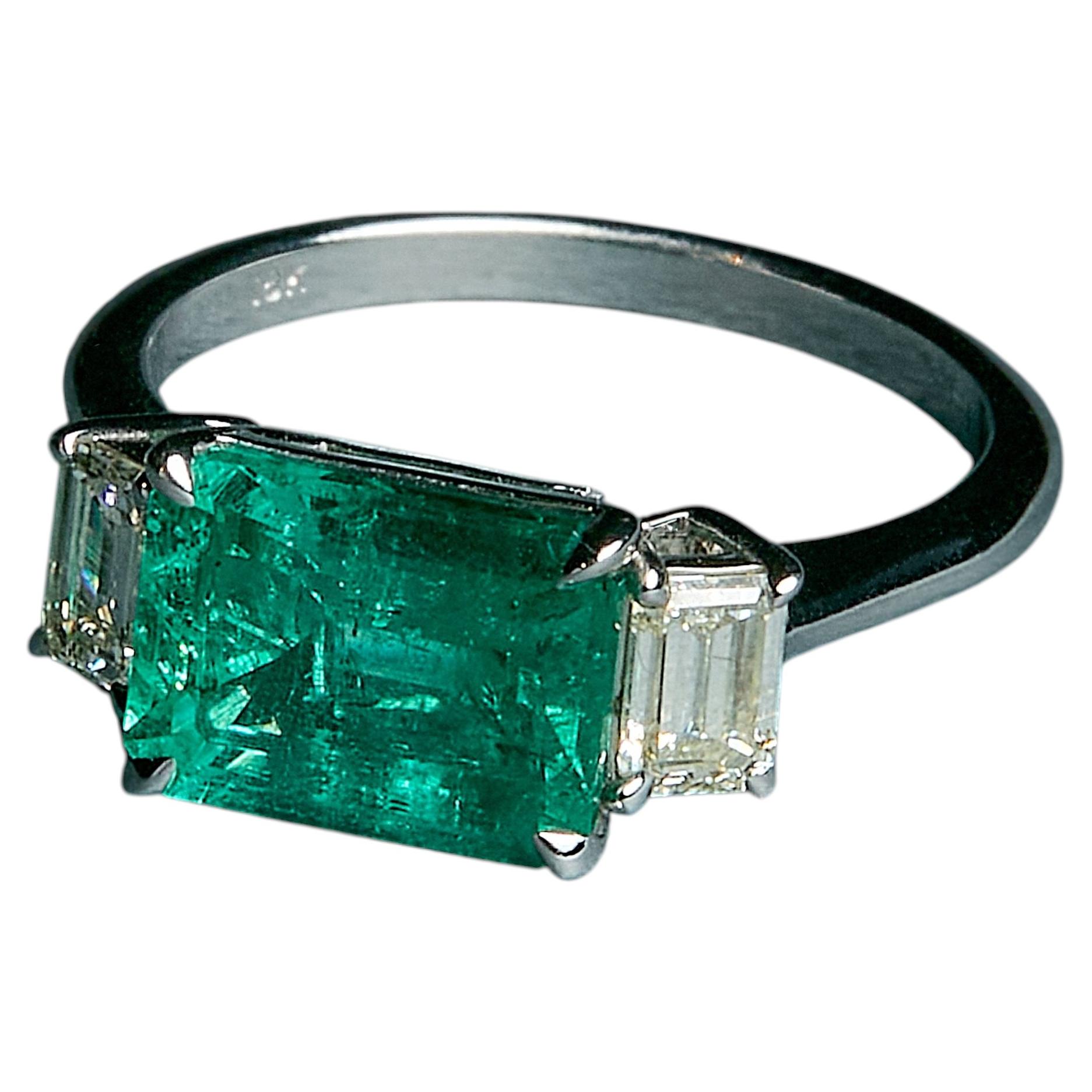 East West Emerald and Diamond Ring in 18k White Gold by Maria Jose Jewelry
