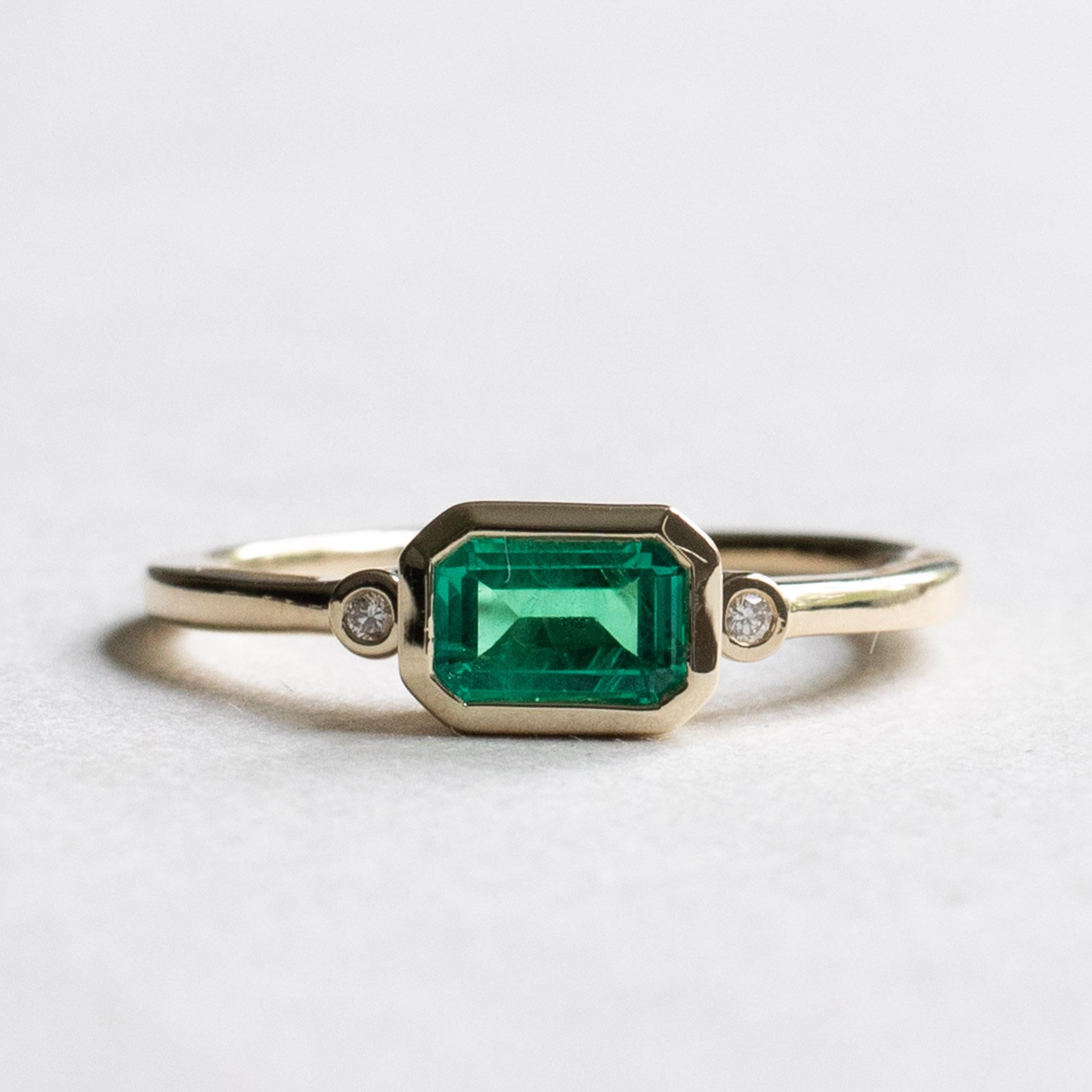 emerald east west ring