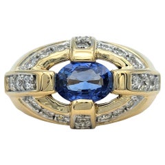 East-West Oval Cut Blue Sapphire Dome Ring with Diamonds in 14 Karat Yellow Gold